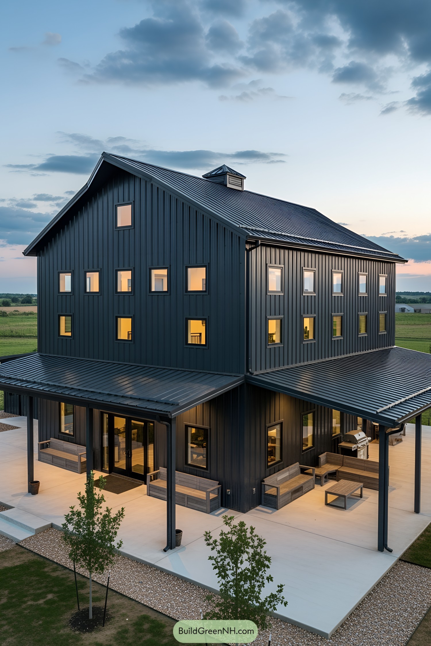 Large modern barndominium with evening lights