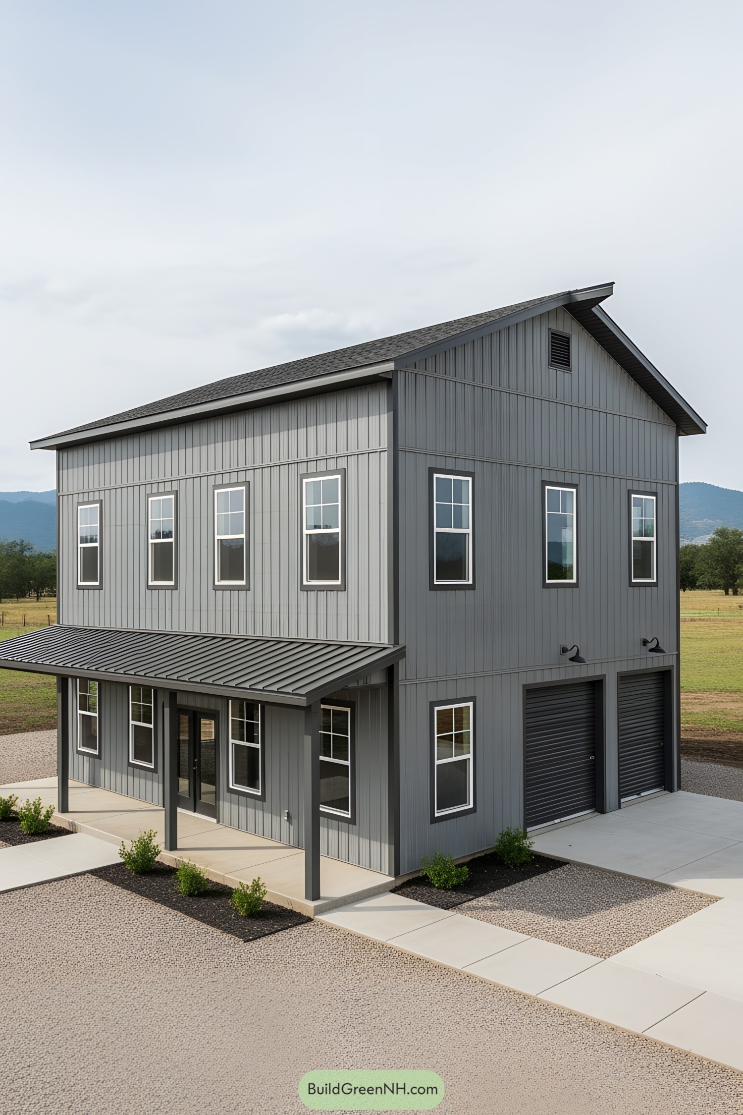Gray barndominium with modern windows and garage