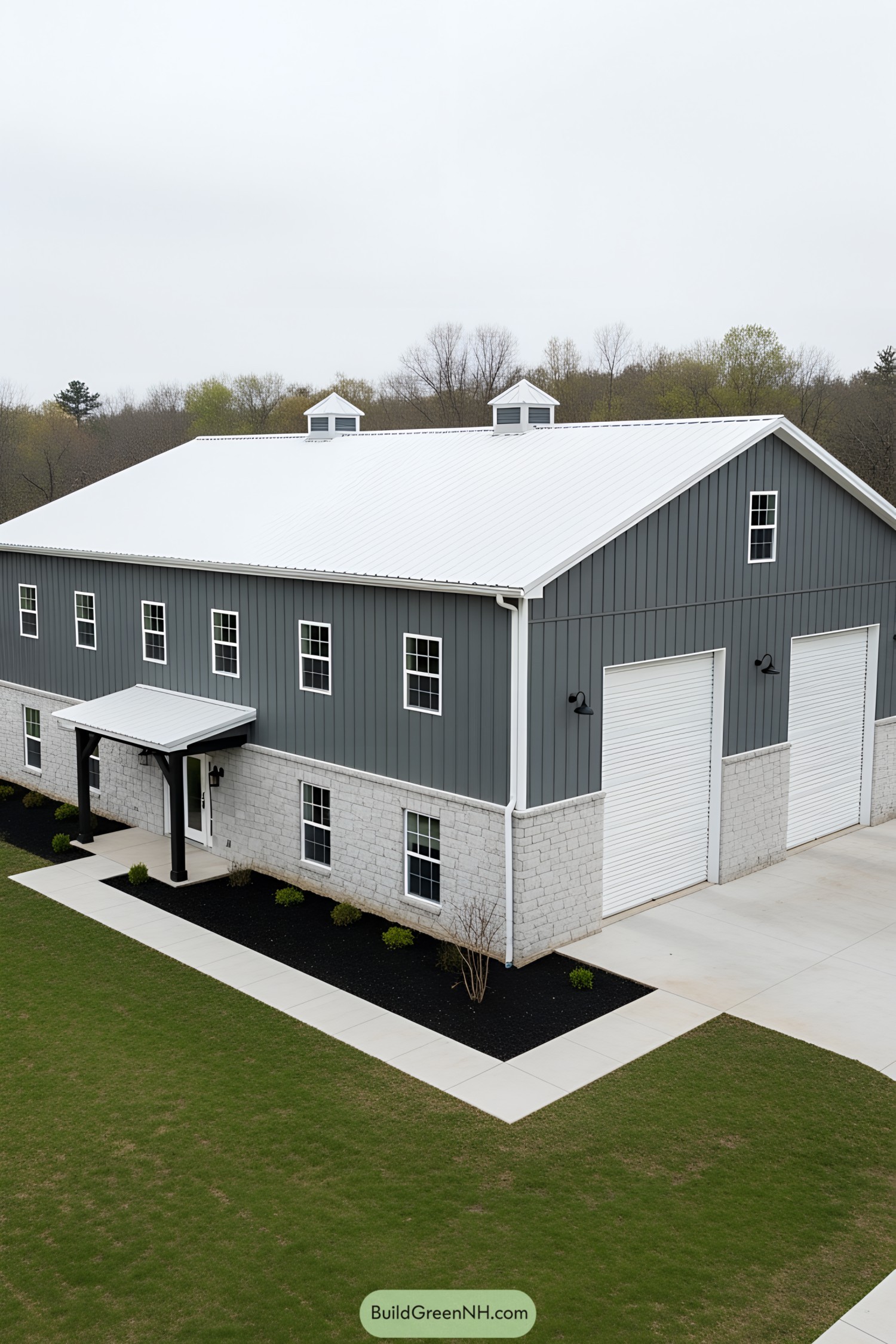 Cozy gray barndominium with white roof