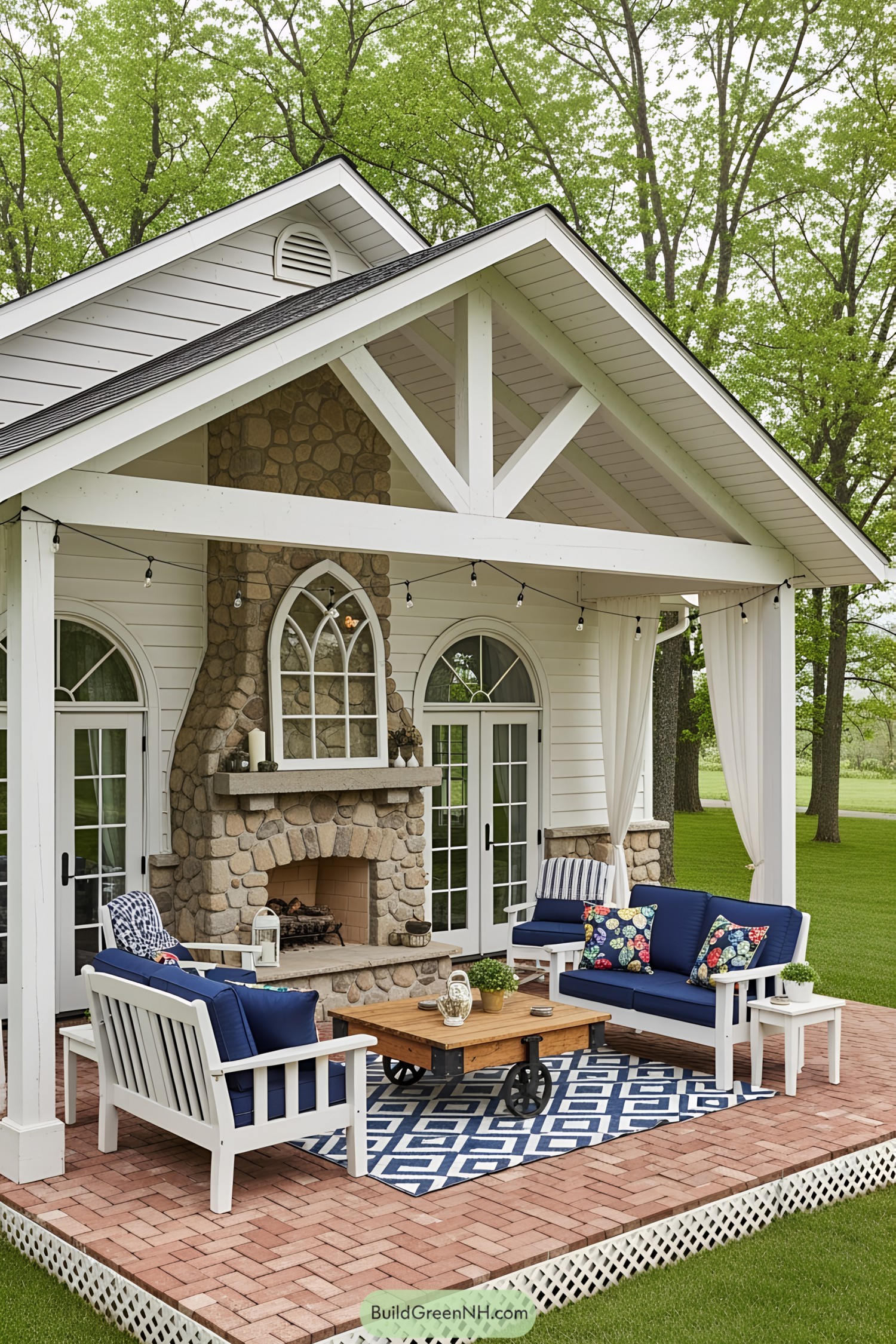 Cozy patio with stone fireplace and blue seating