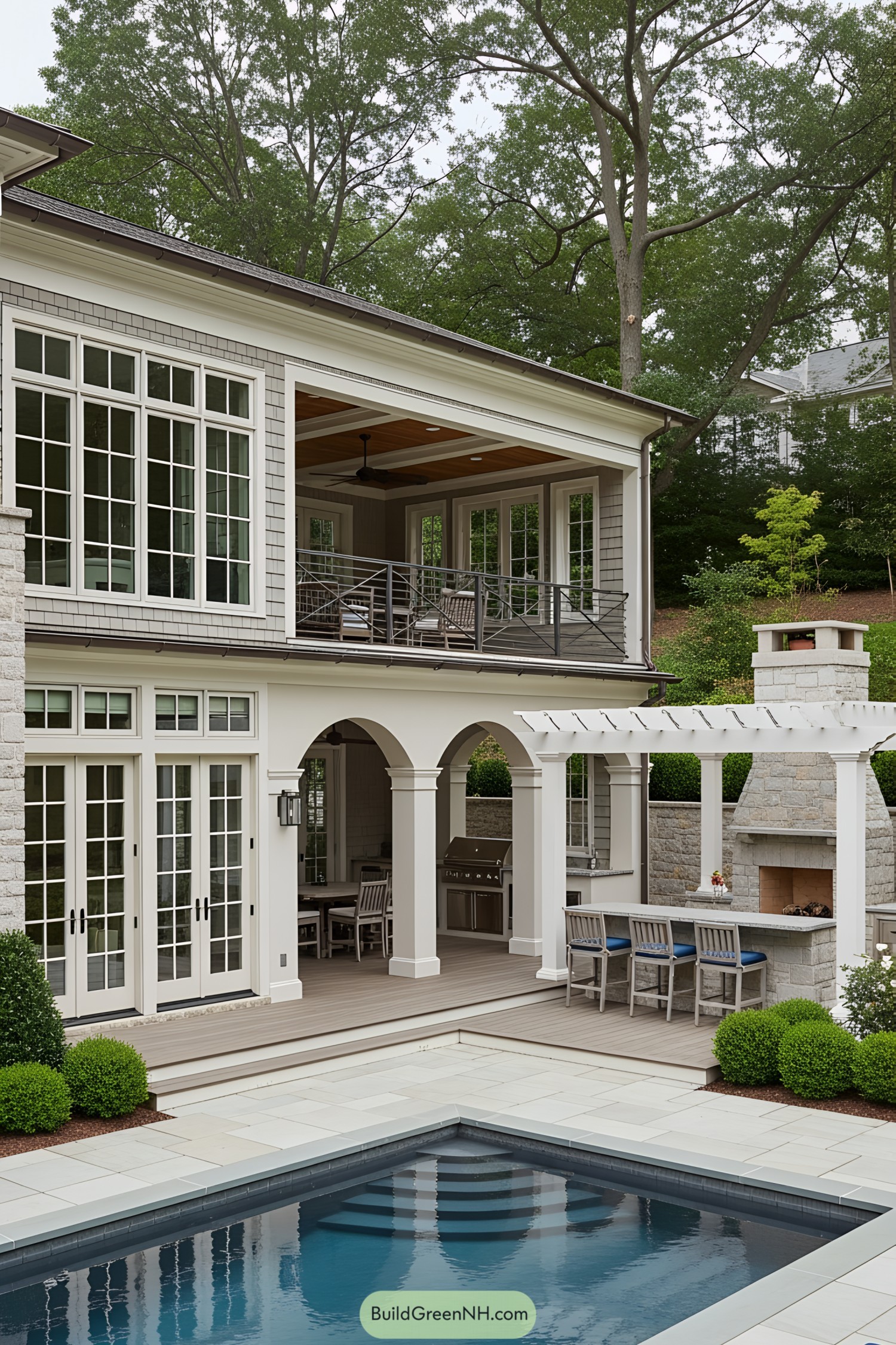 Outdoor living space with pool, arches, and fireplace