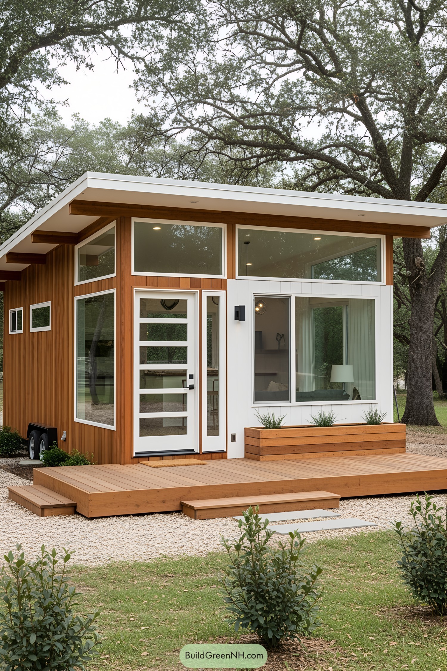 Chic modern tiny house with large windows and wooden deck