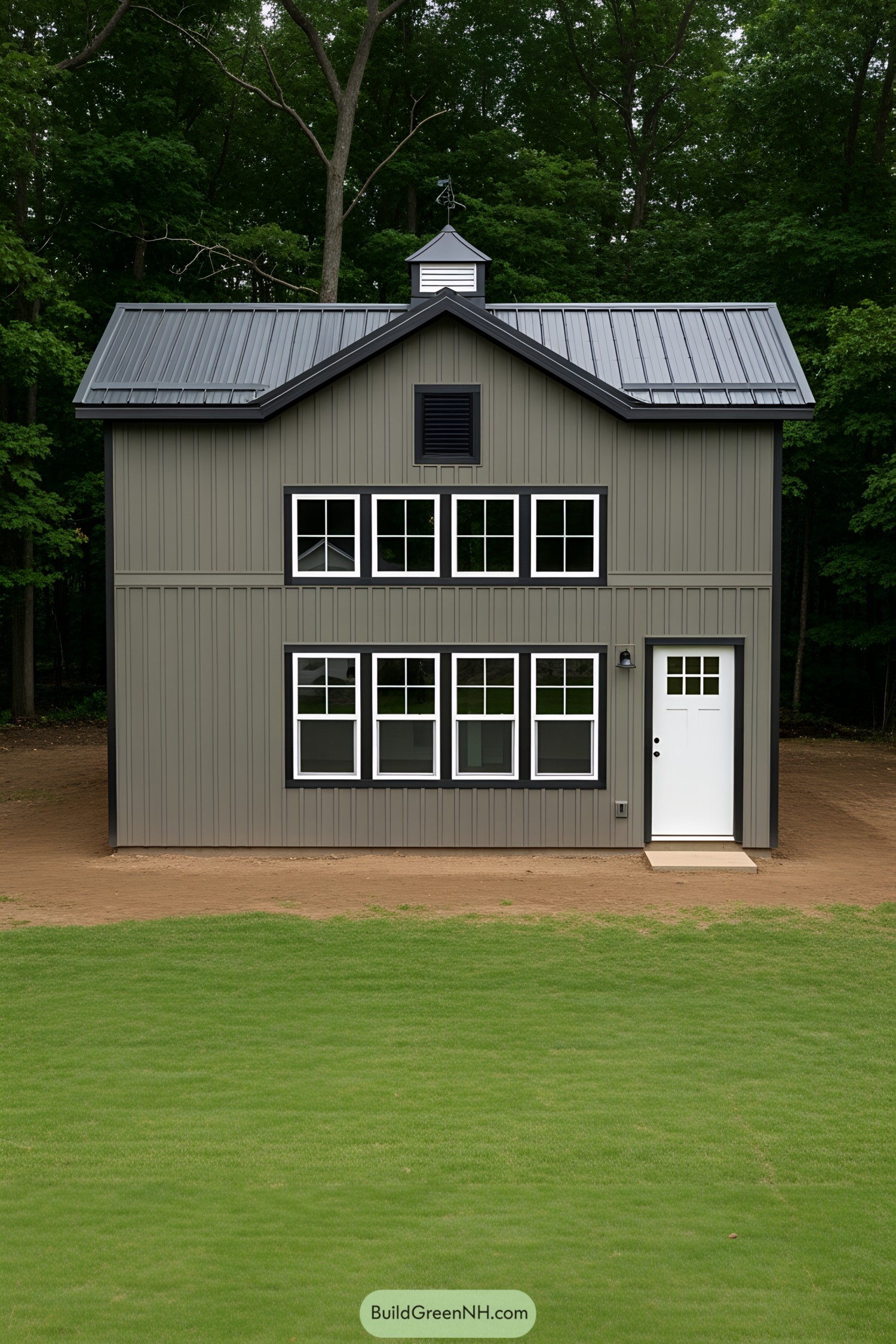 Miniature barn house with large windows and a sleek roof