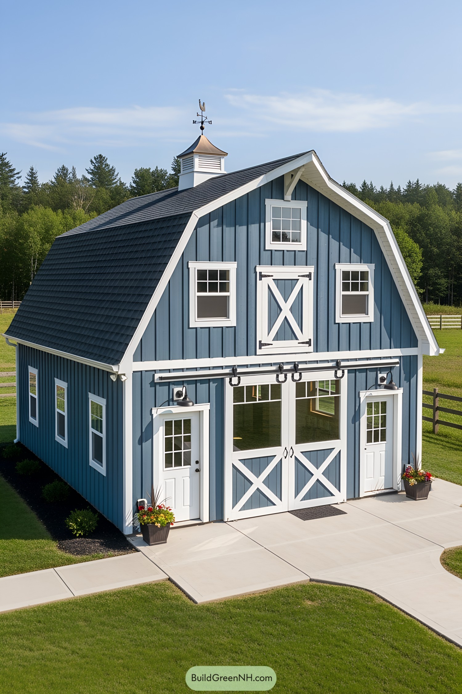Blue mini barn with white accents on a sunny day