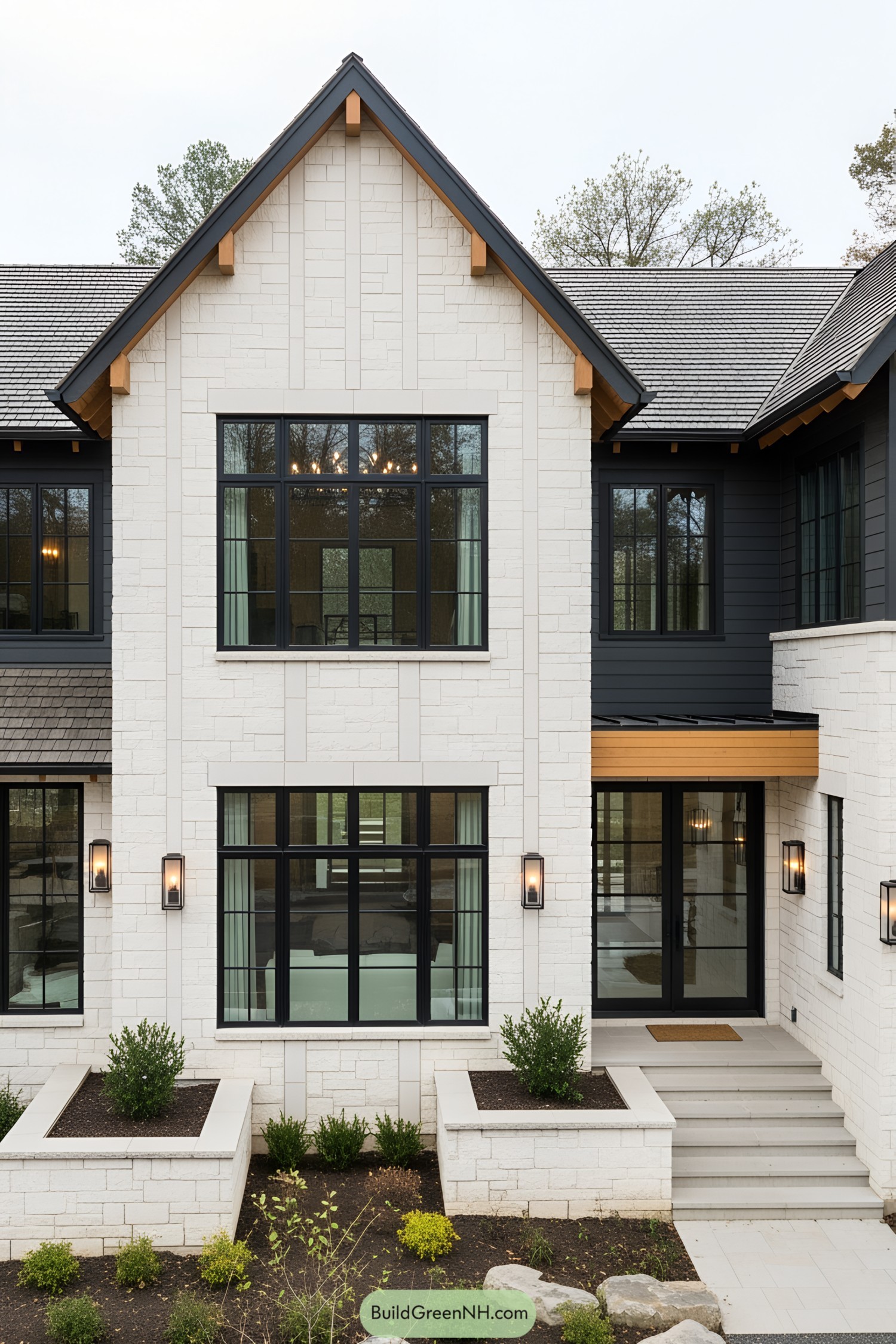 Modern house with black-framed windows and light stone exterior