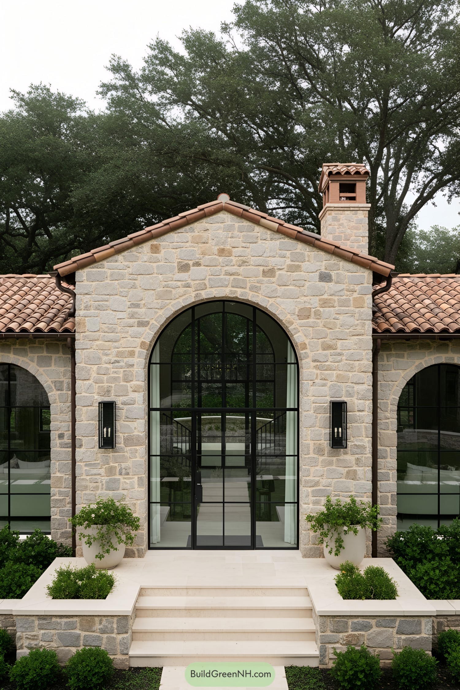 Modern Mediterranean house with stone facade and terracotta roof