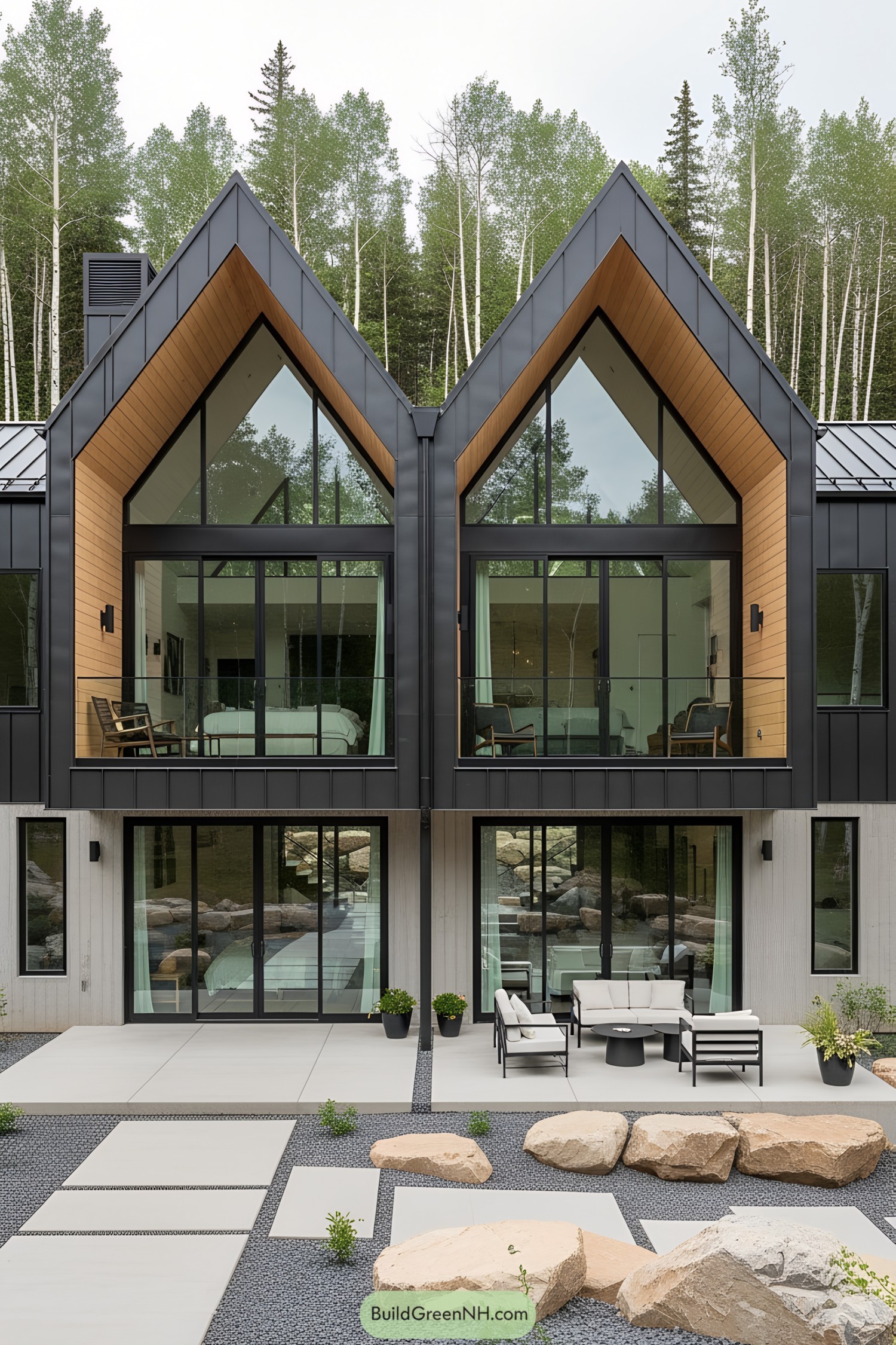 Modern mountain cottage with large glass windows and a patio