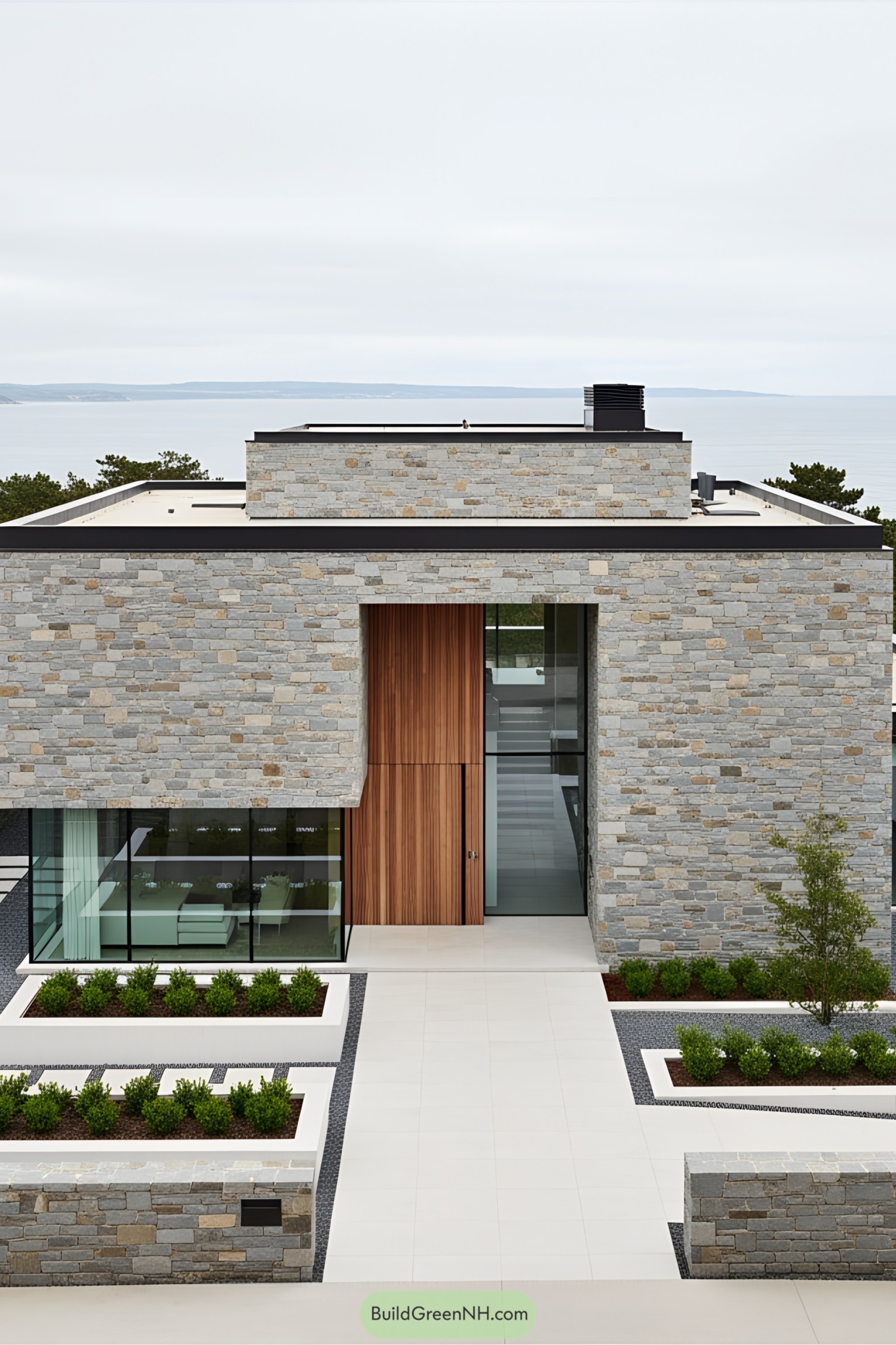 Minimalistic stone house with large glass windows and wooden accents
