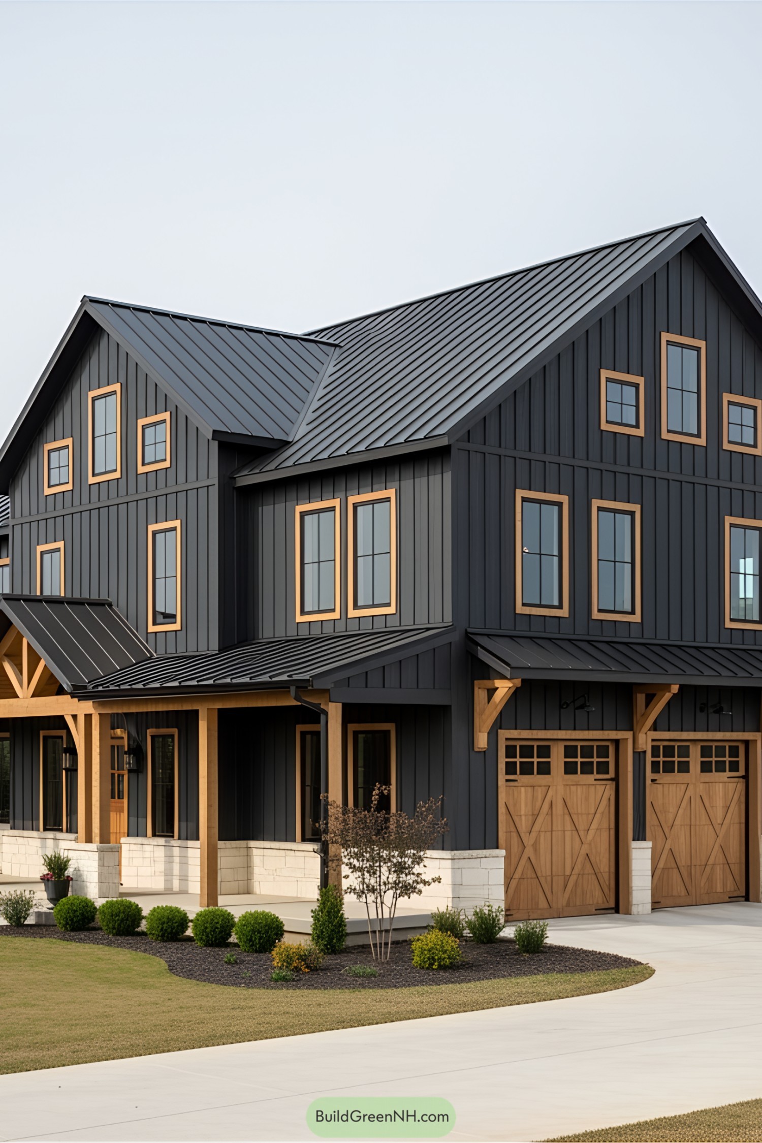 Modern multi-story barndominium with wood accents