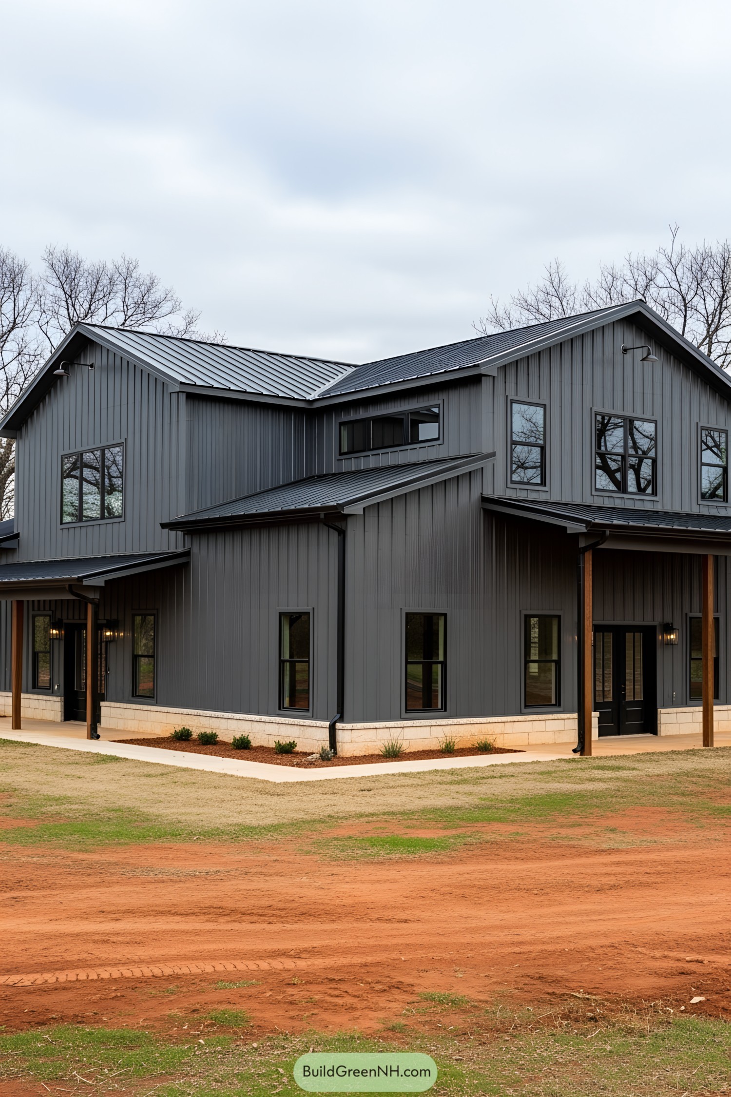 Modern gray barndominium with a metal roof