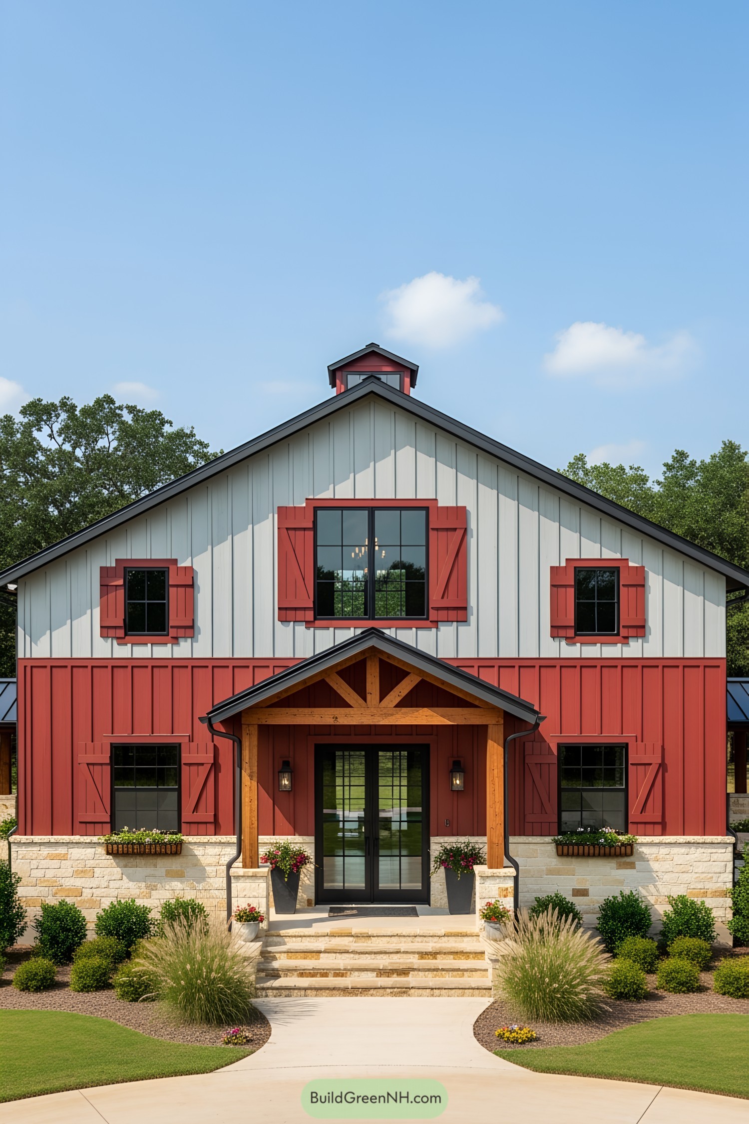 Ranch barndominium with red and white exterior, charming entryway, and landscaping