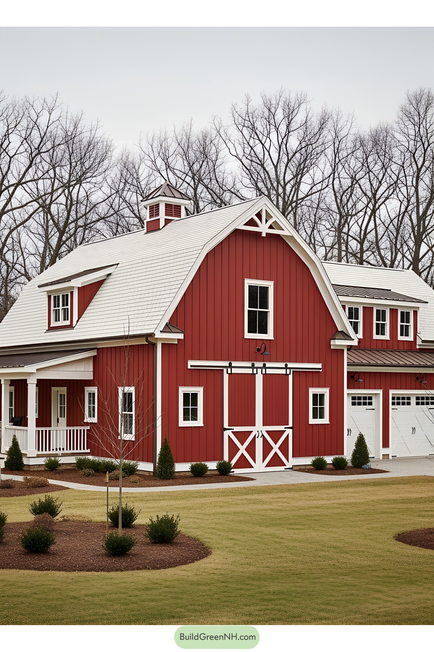 Charming red barn house with white accents and lush lawn