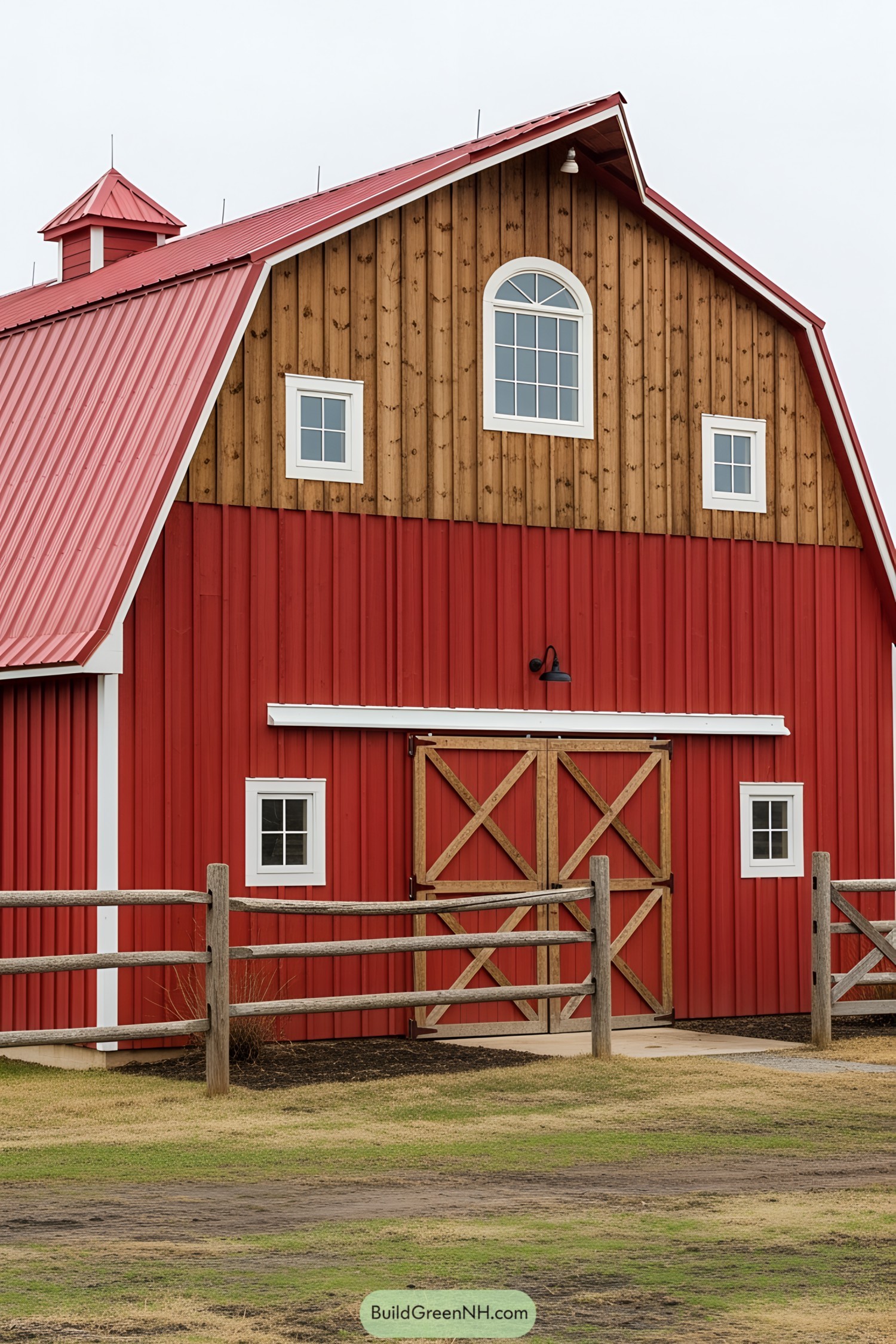 Red barn with wooden accents and white-framed windows