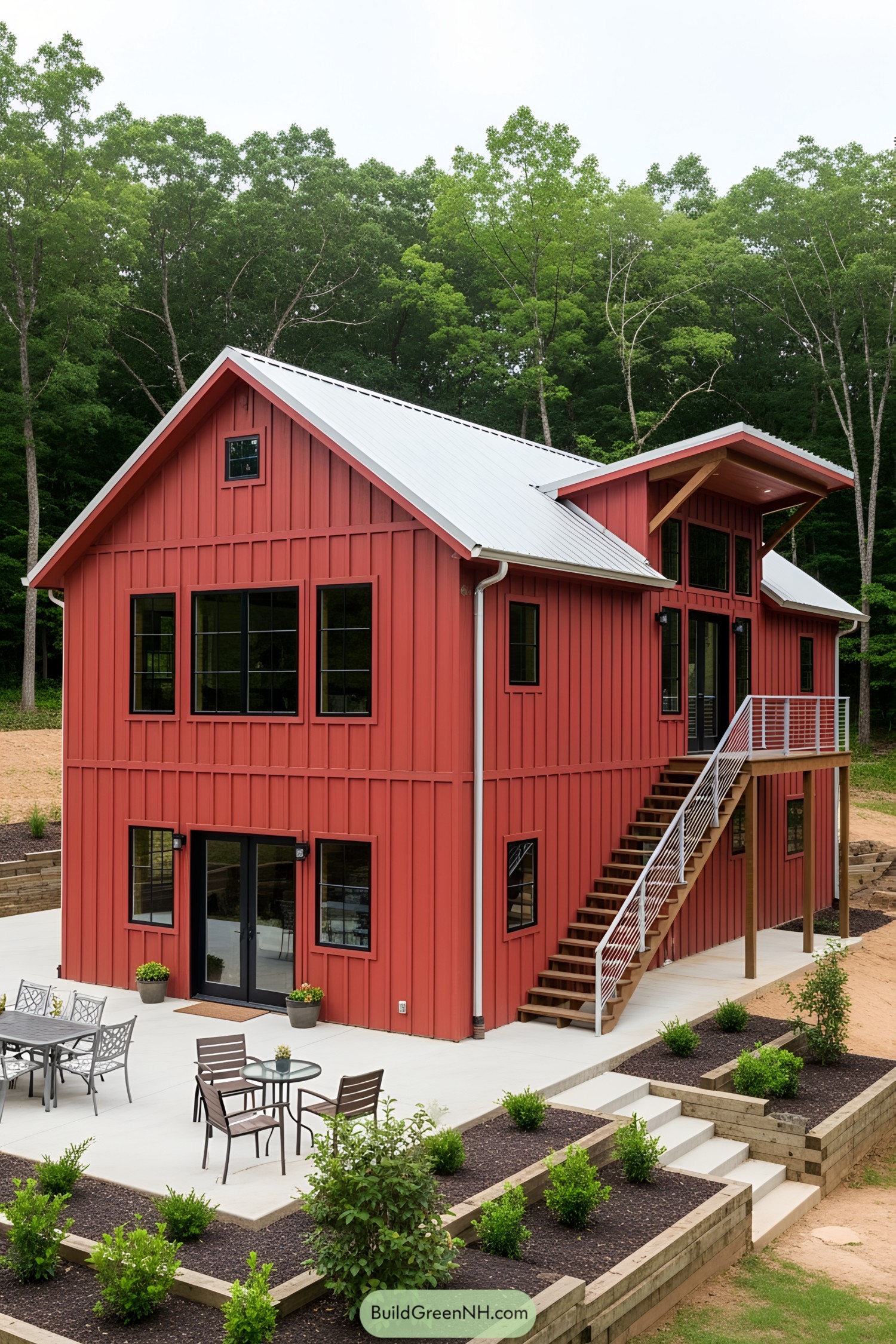Red barndominium with white roof and large patio