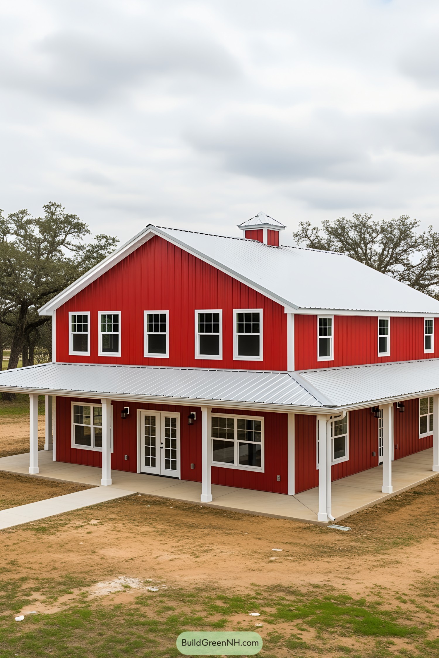 Vibrant red barndominium with a modern roof and spacious porch