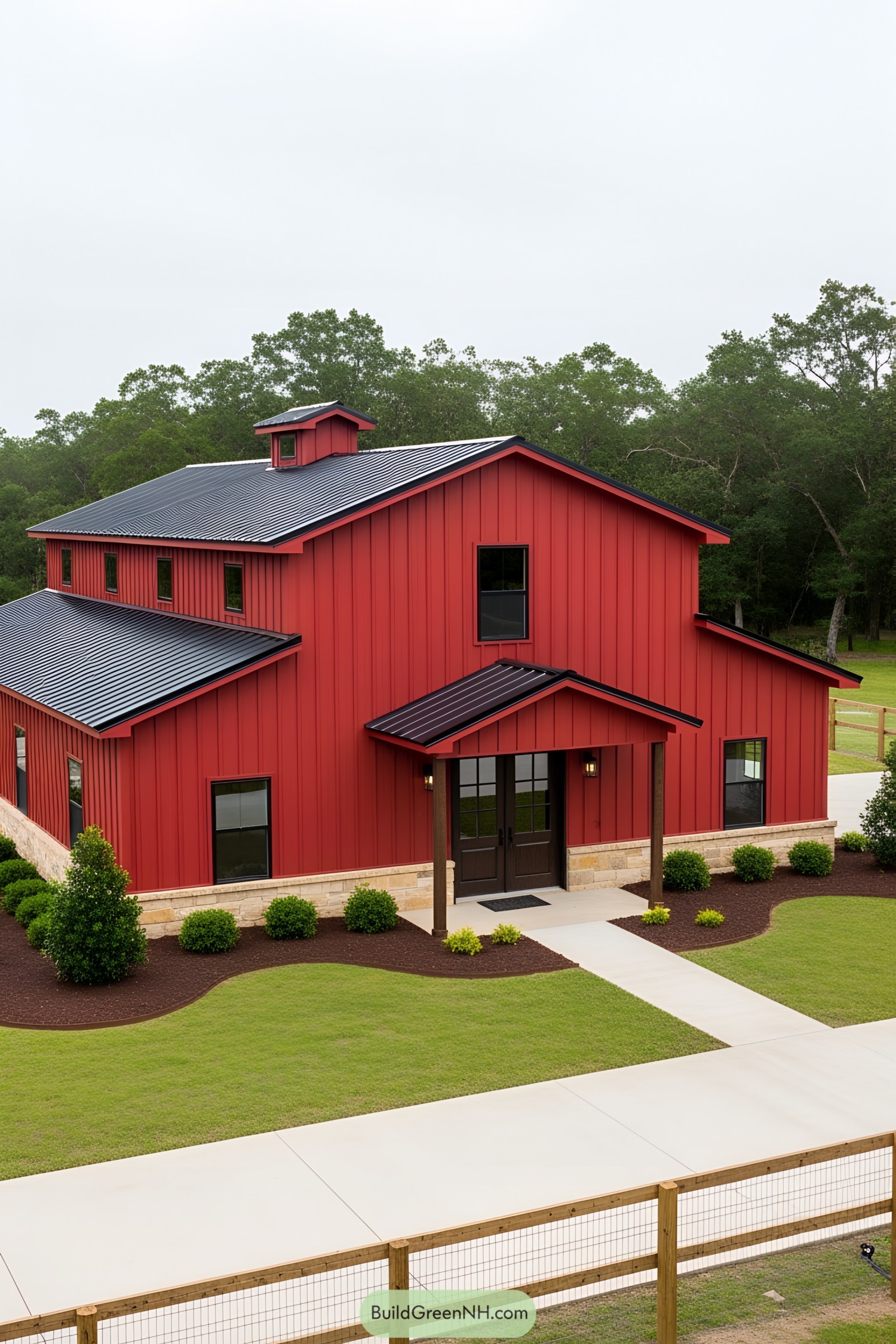 A vibrant red barndominium with a clean design