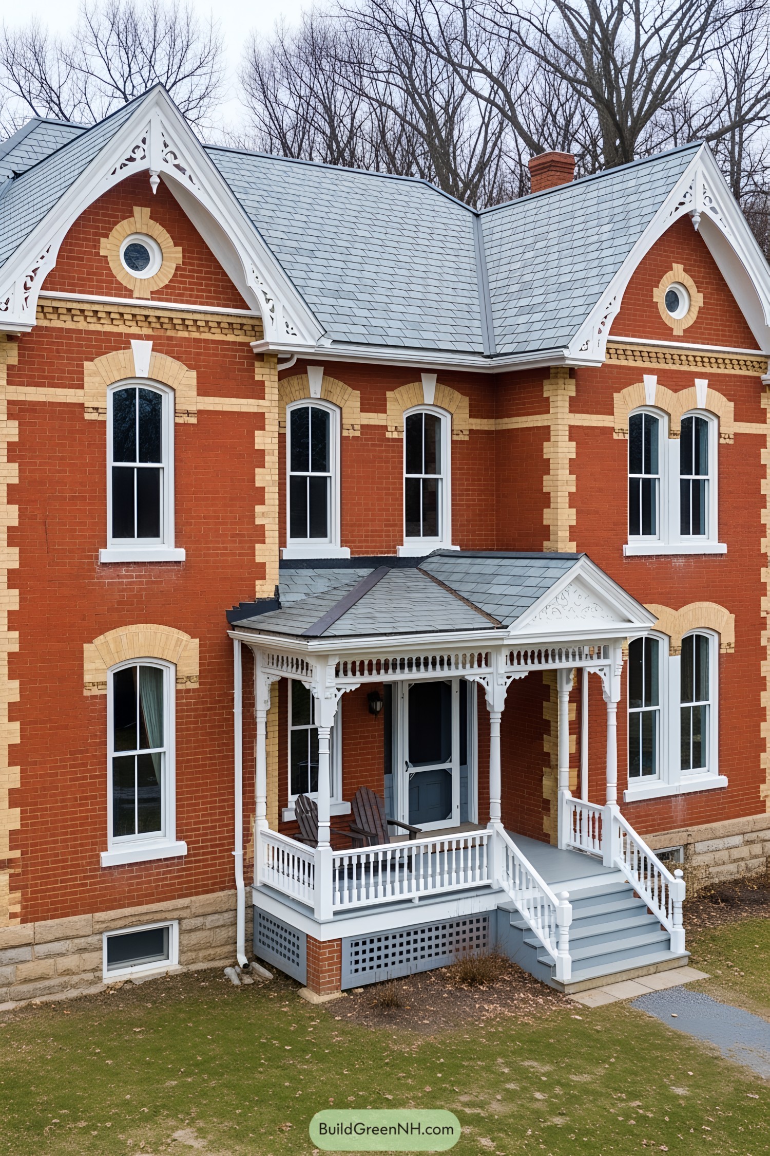 Classic red brick farmhouse with intricate white trim and dormer windows