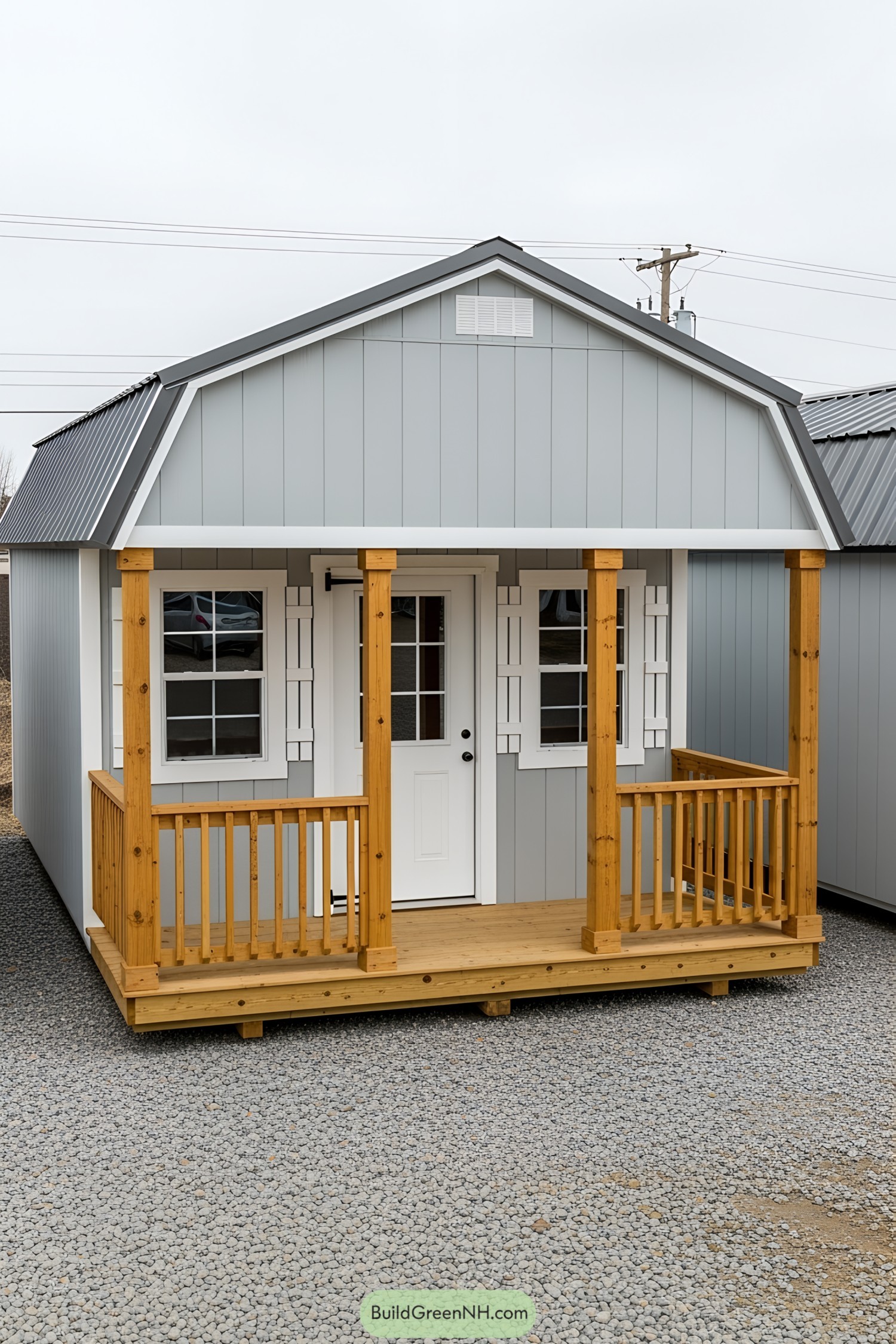 Cute gray shed with wooden porch