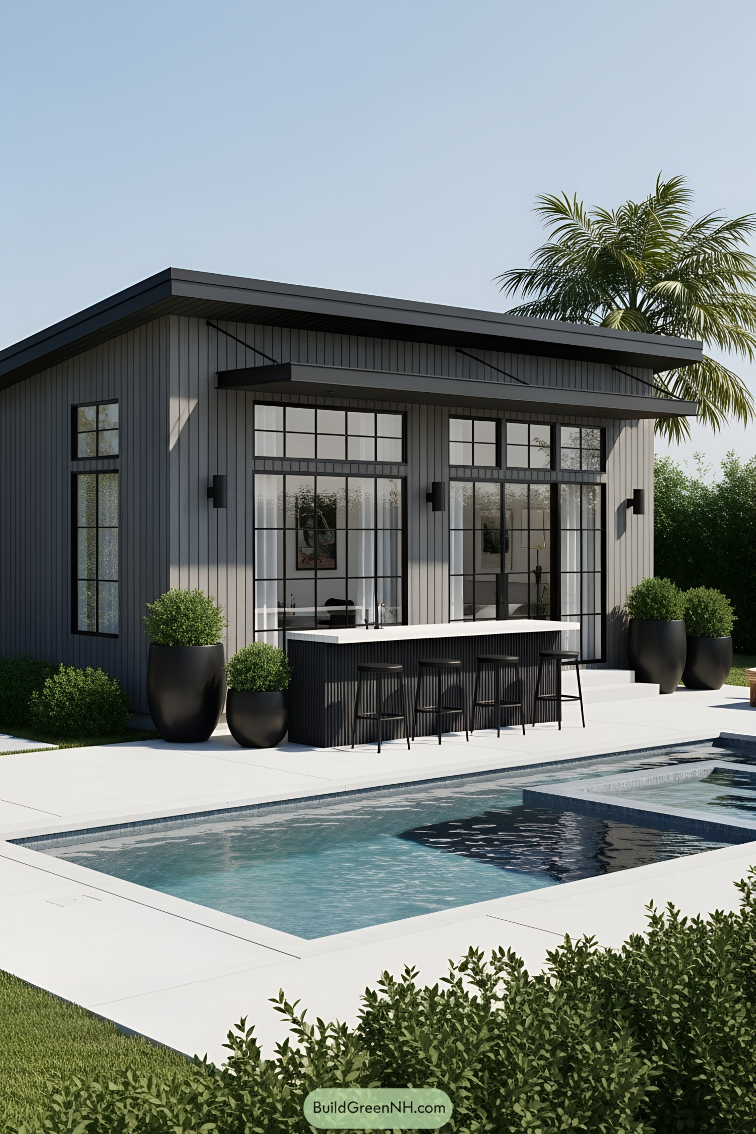 Small house with a sleek modern pool, surrounded by tall windows and greenery