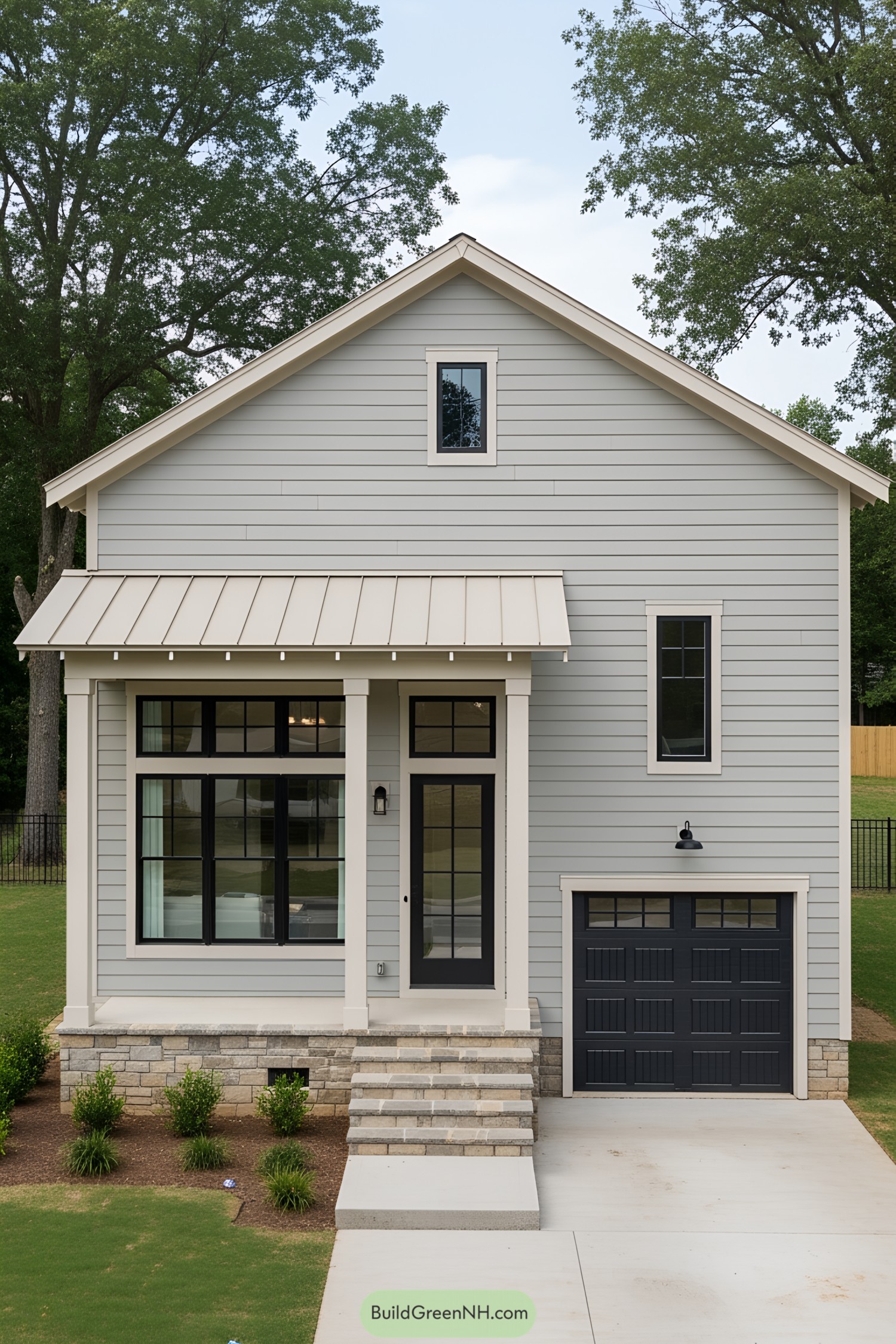 Compact gray house with black accents and a welcoming porch