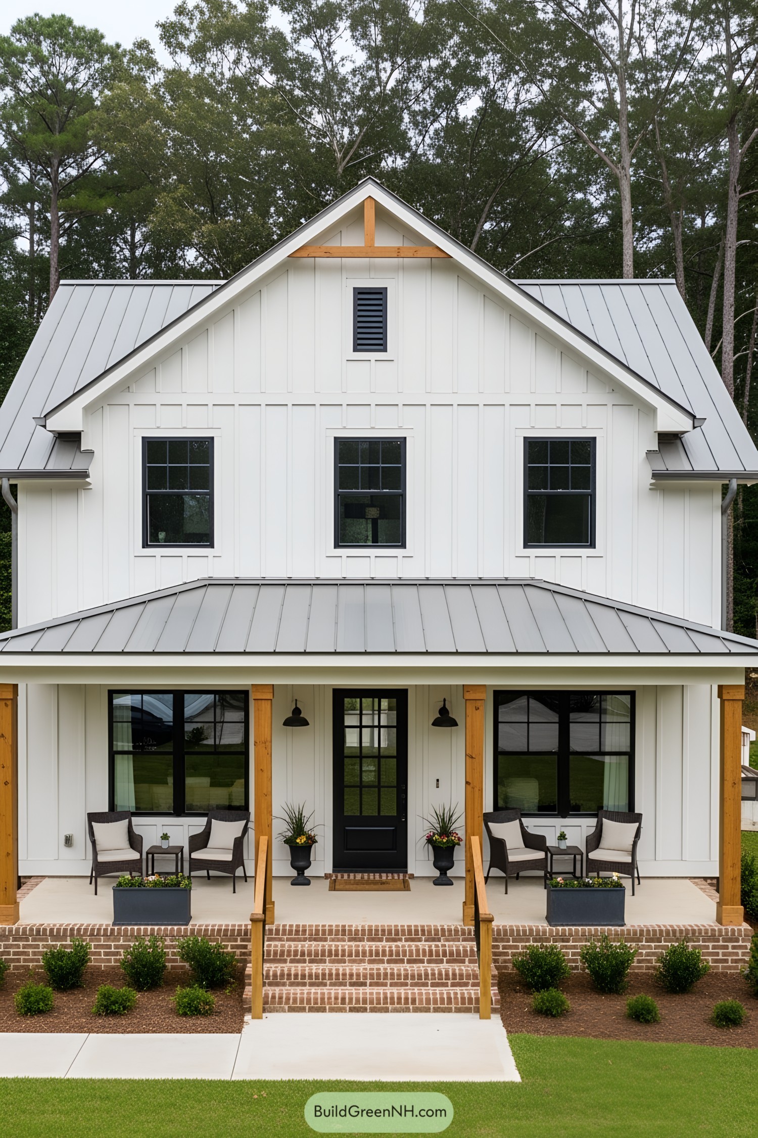 White cottage with porch and greenery