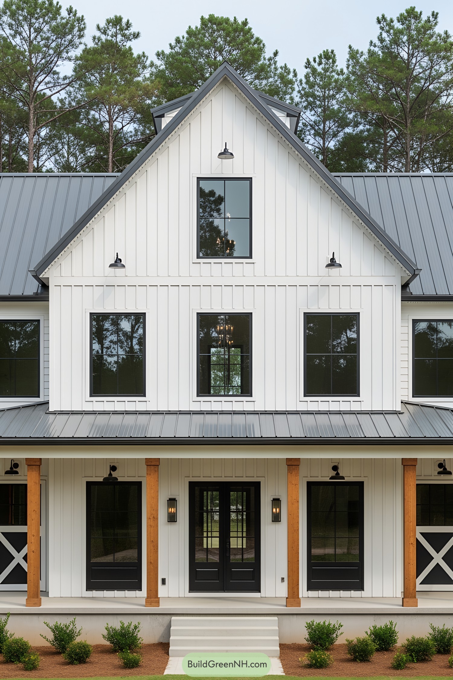 Tall white barndominium with black doors and windows
