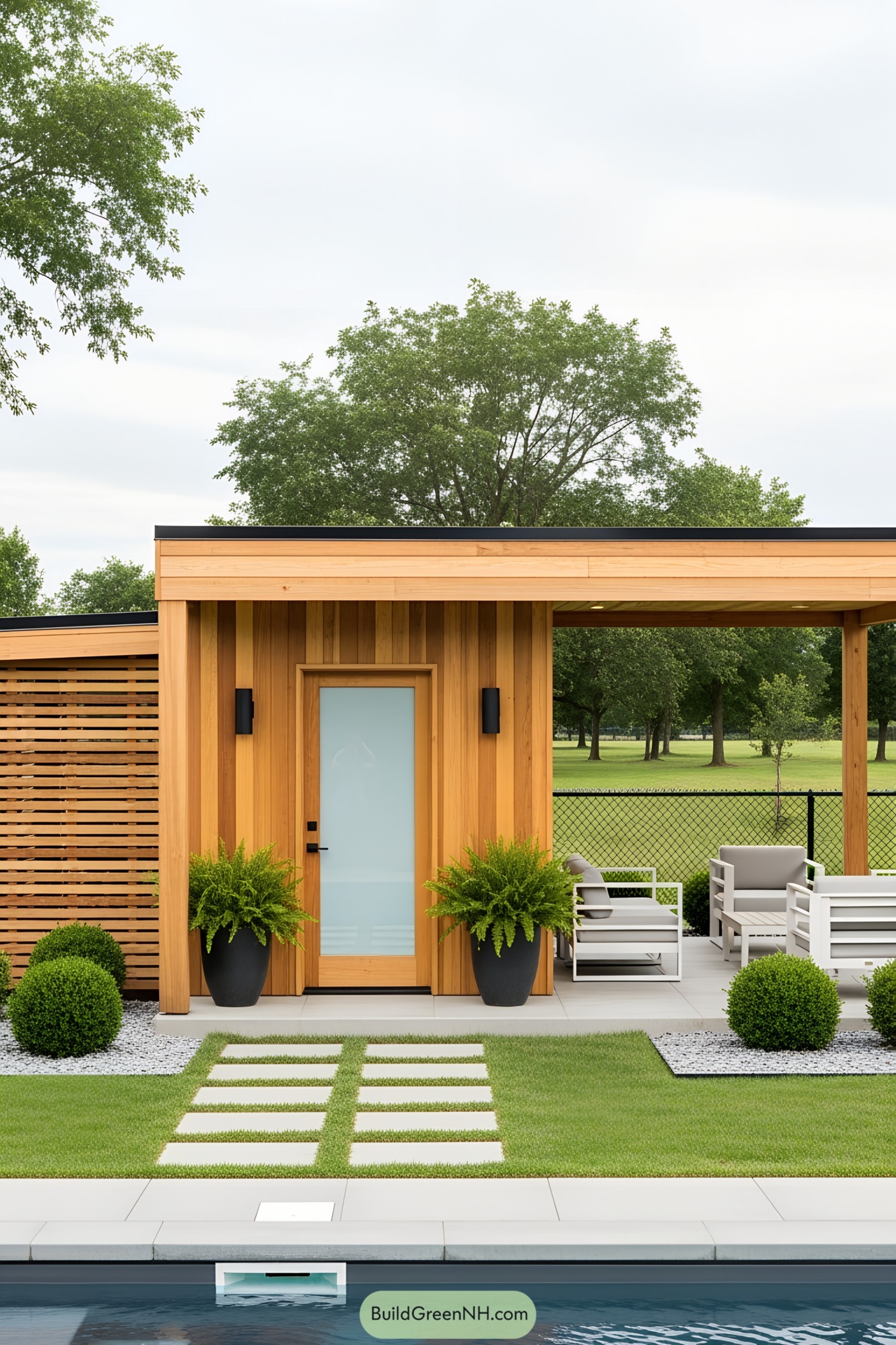 Small wooden pool house with ferns and seating area
