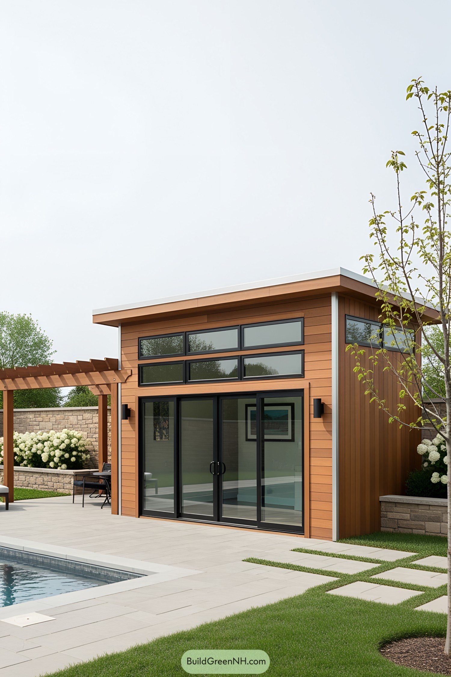 Small modern pool house with wood paneling and large glass doors