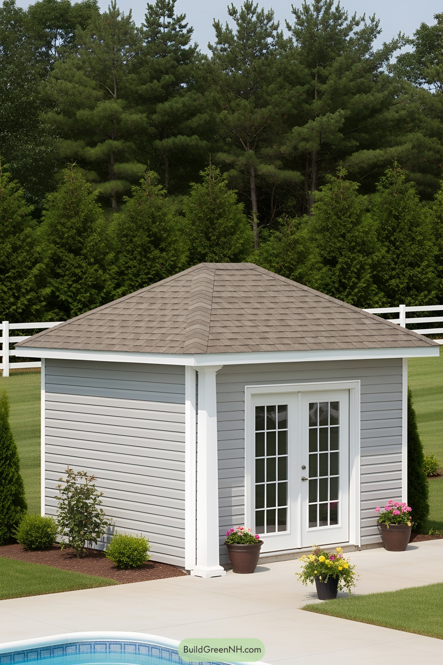 Compact poolside house with gray siding and French doors