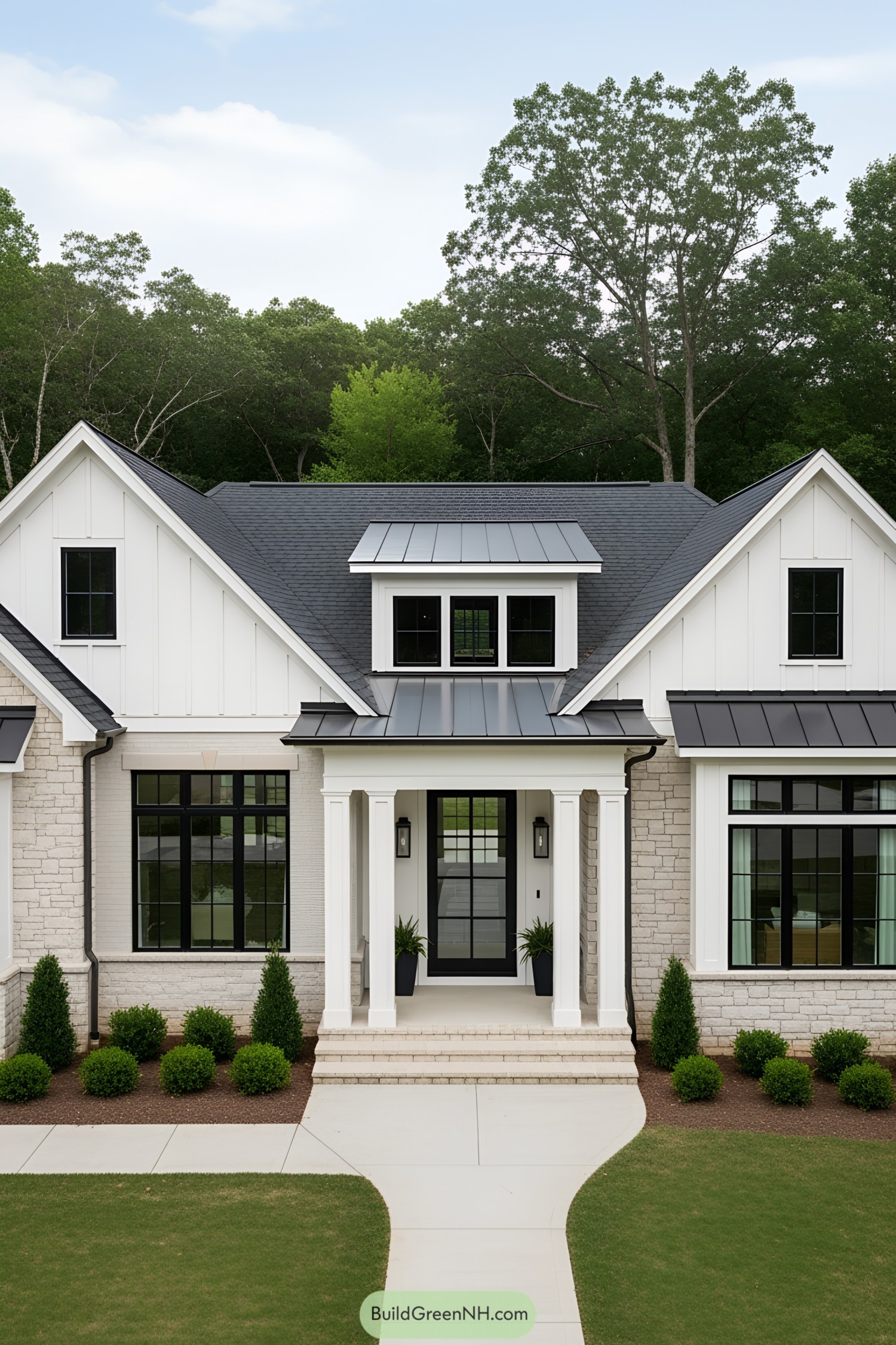 White house with dark roof and lush surroundings