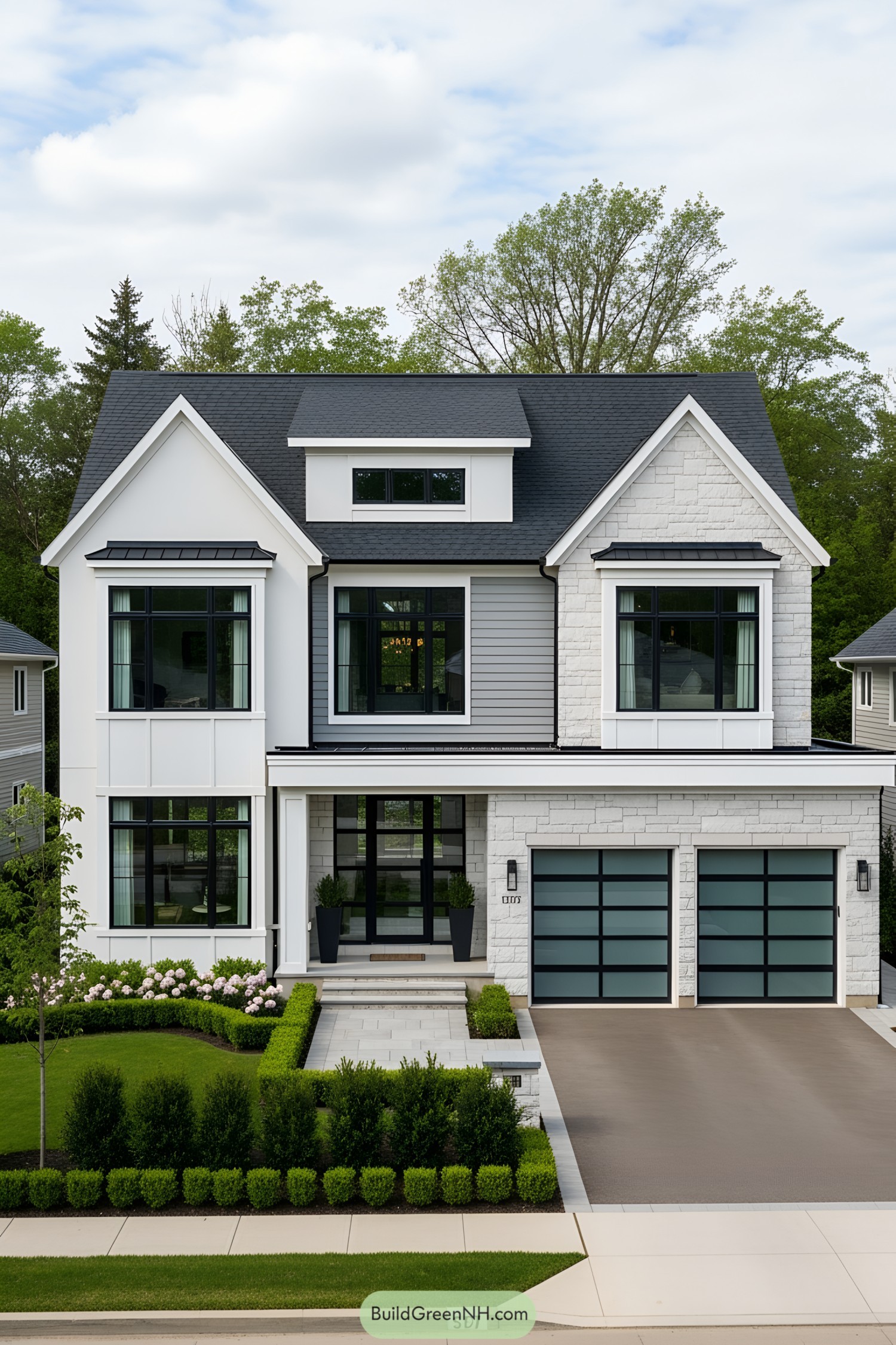 Modern house with symmetrical design and lush greenery