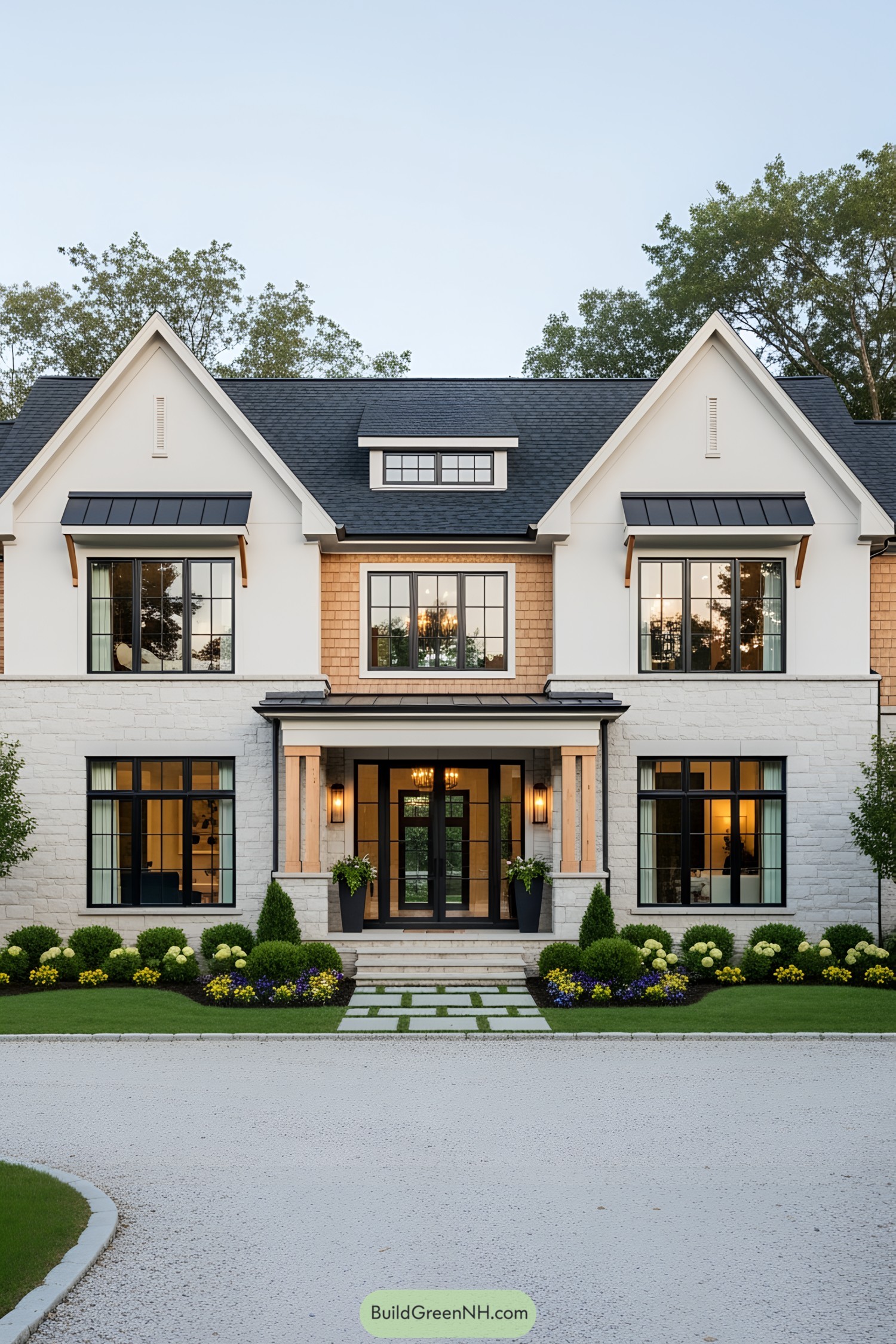 Front view of a stylish transitional house with manicured landscaping