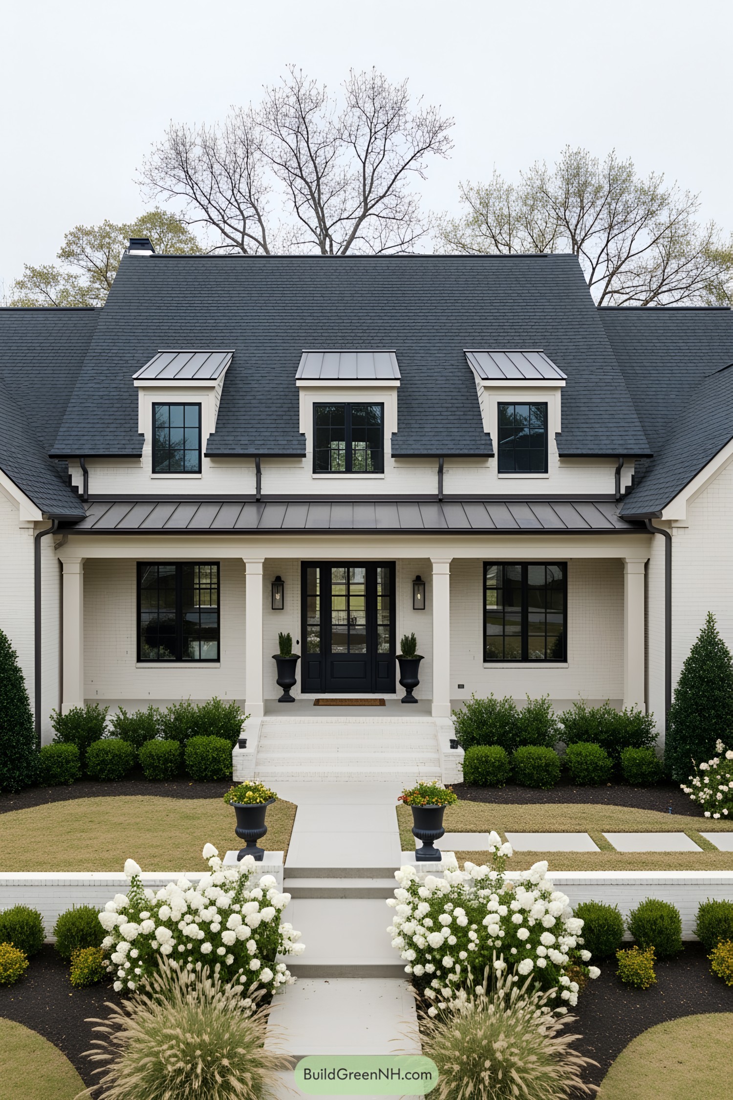 Transitional house with manicured lawn and black-trimmed windows
