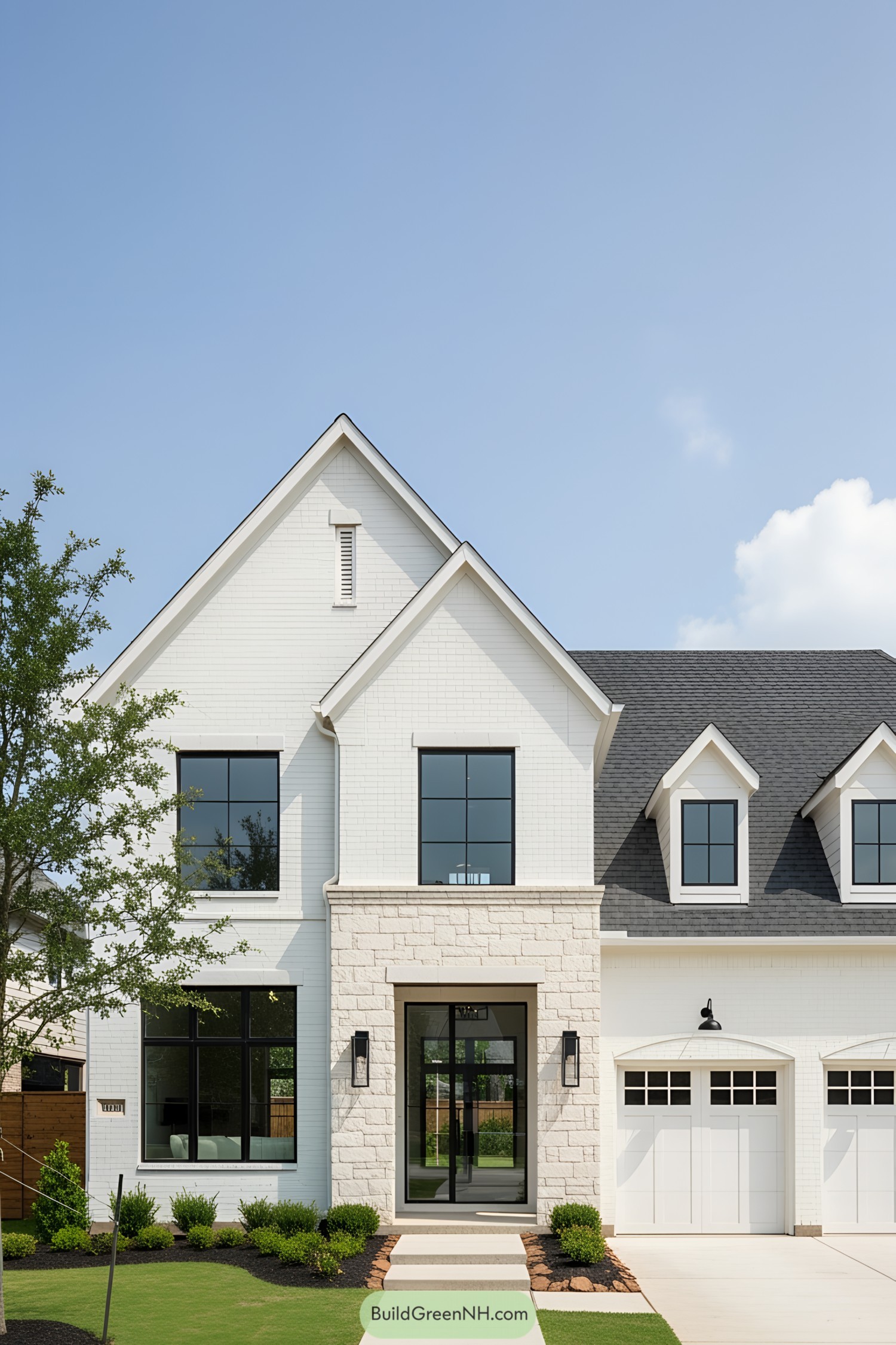 Modern white house with a steep gabled roof and large windows