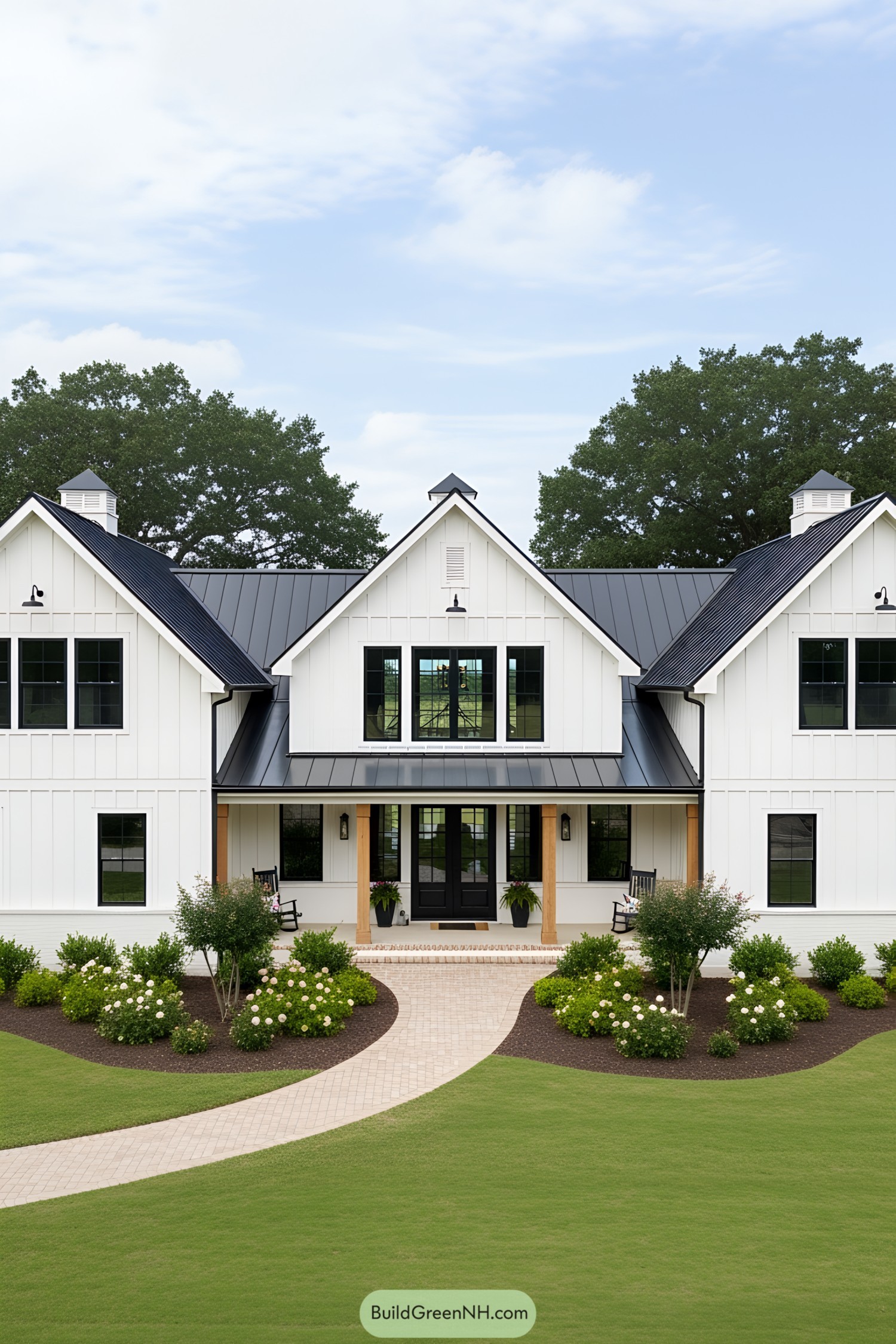 Charming white U-shaped barndominium with black accents