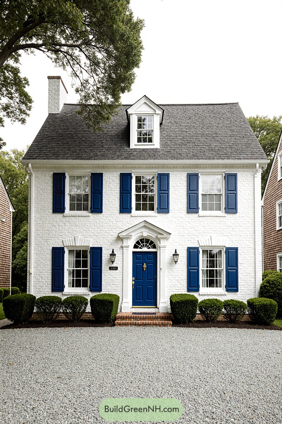 Charming house with crisp white bricks and blue shutters