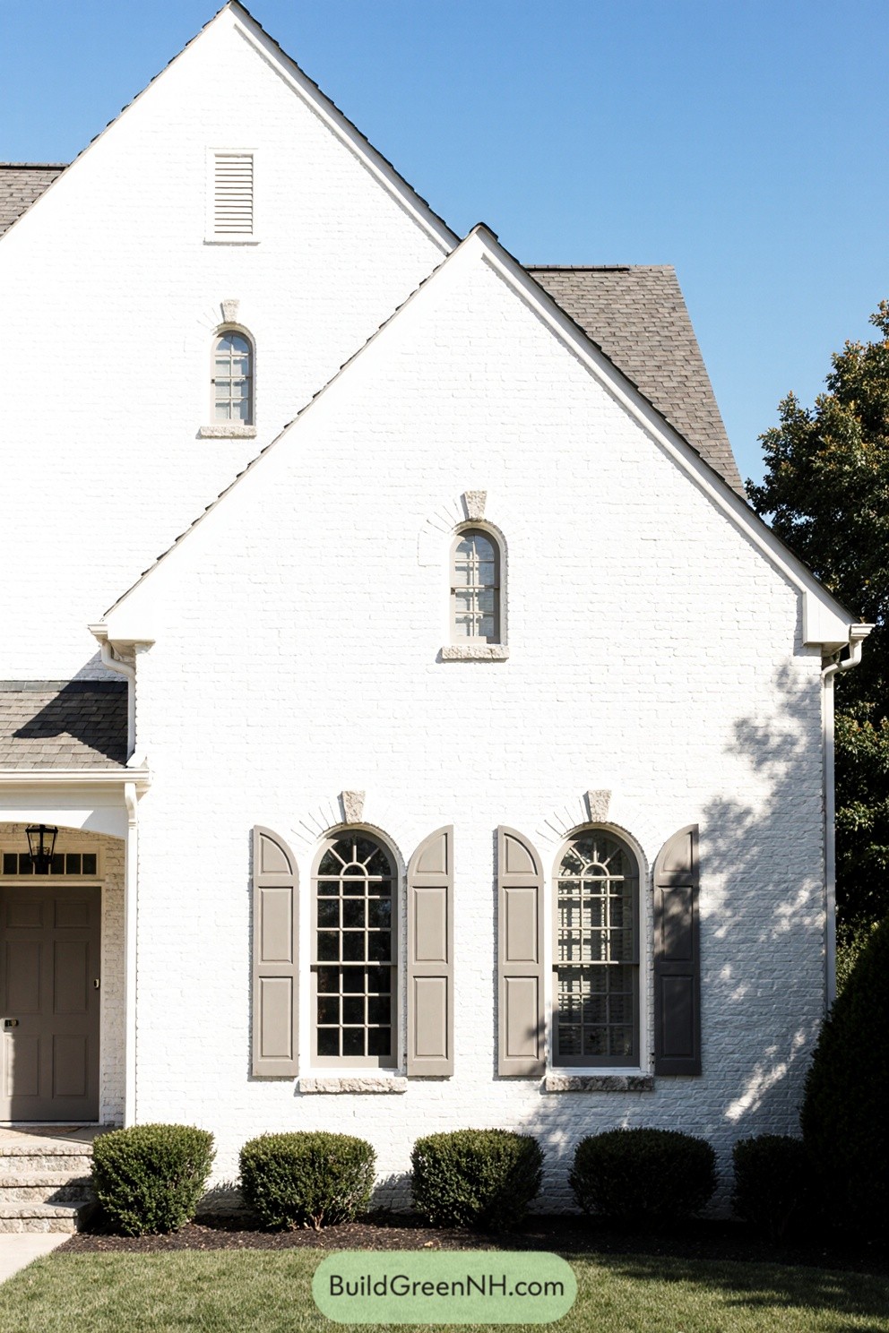 White brick house with gray shutters