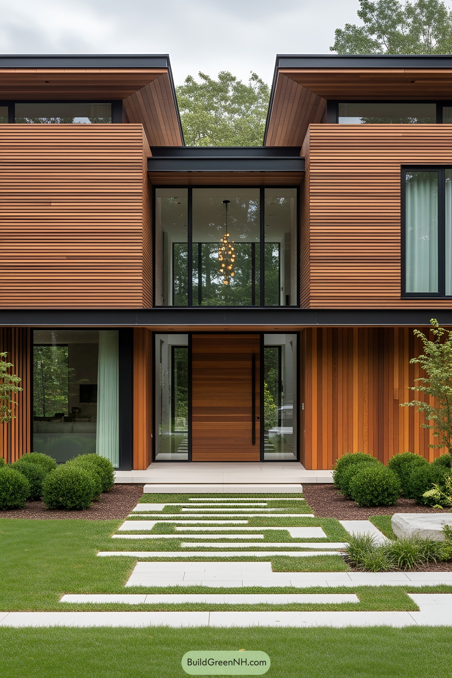 Modern wooden house facade with large glass windows