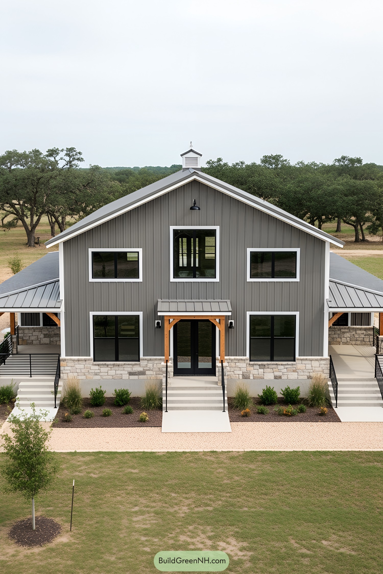 Stylish gray barndominium with a modern facade