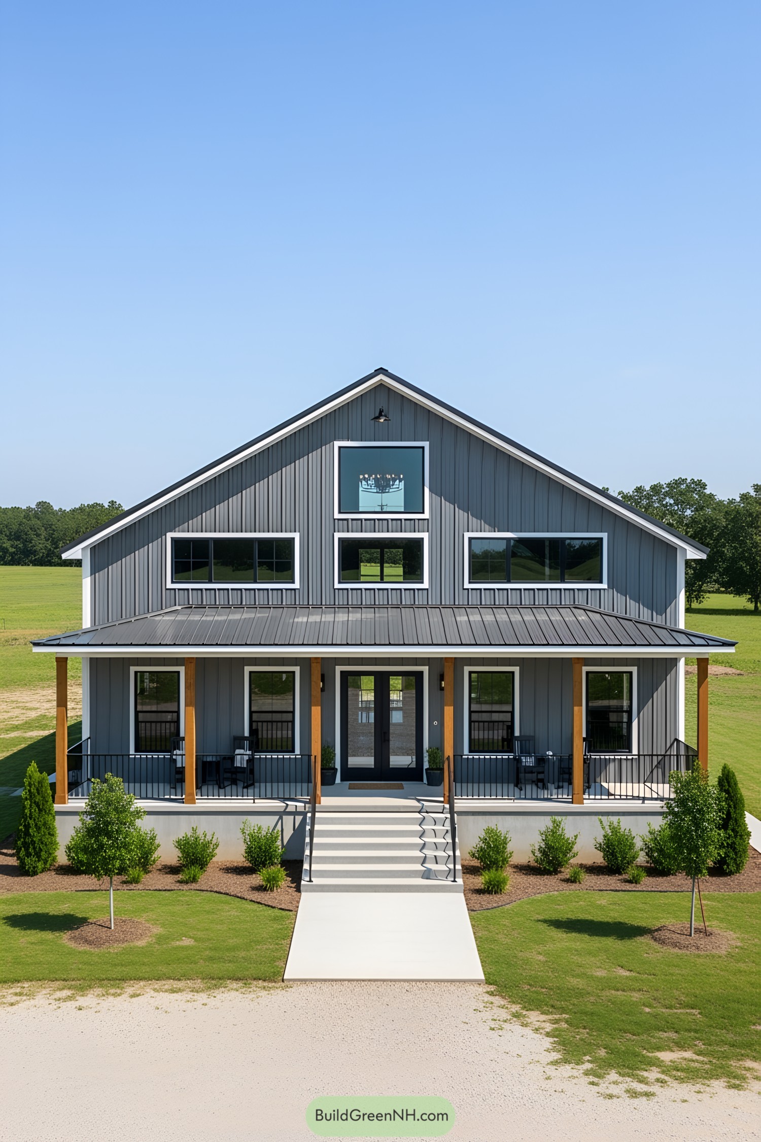 A gray barndominium with a spacious porch
