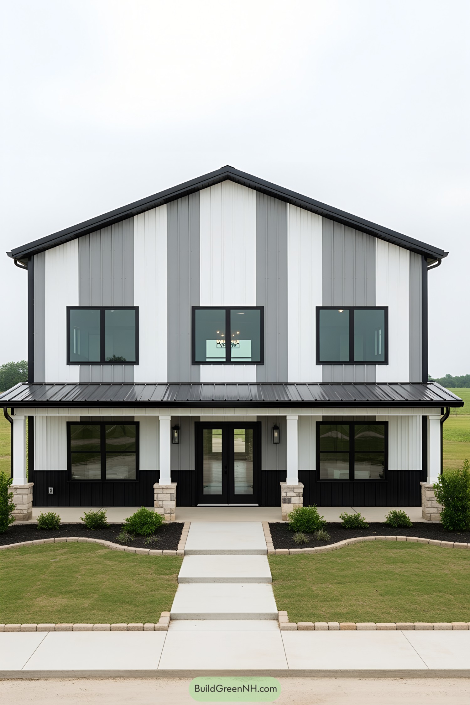 Two-story modern barndominium with black and white siding