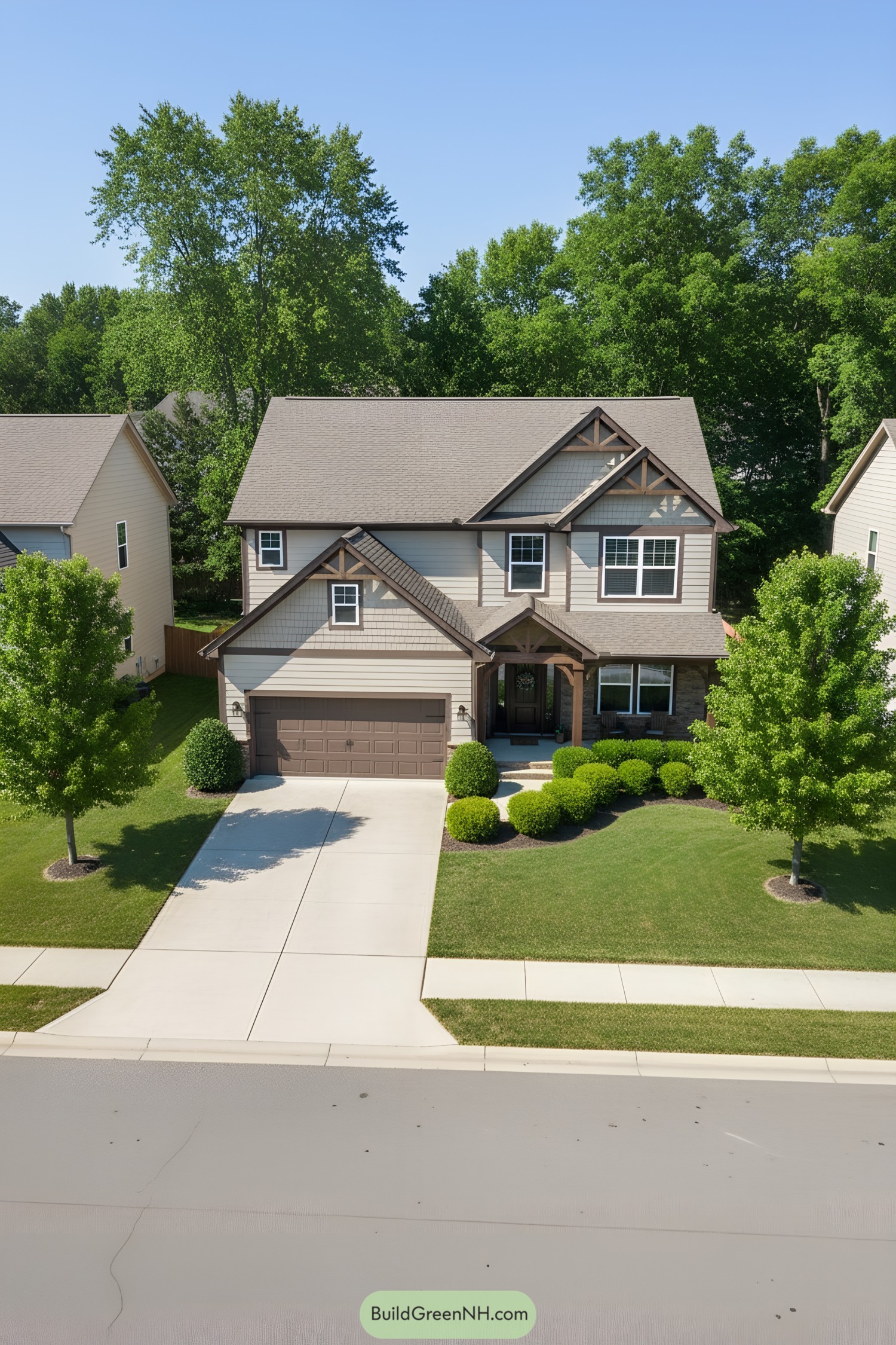 Two-story suburban house with lush lawn and trees