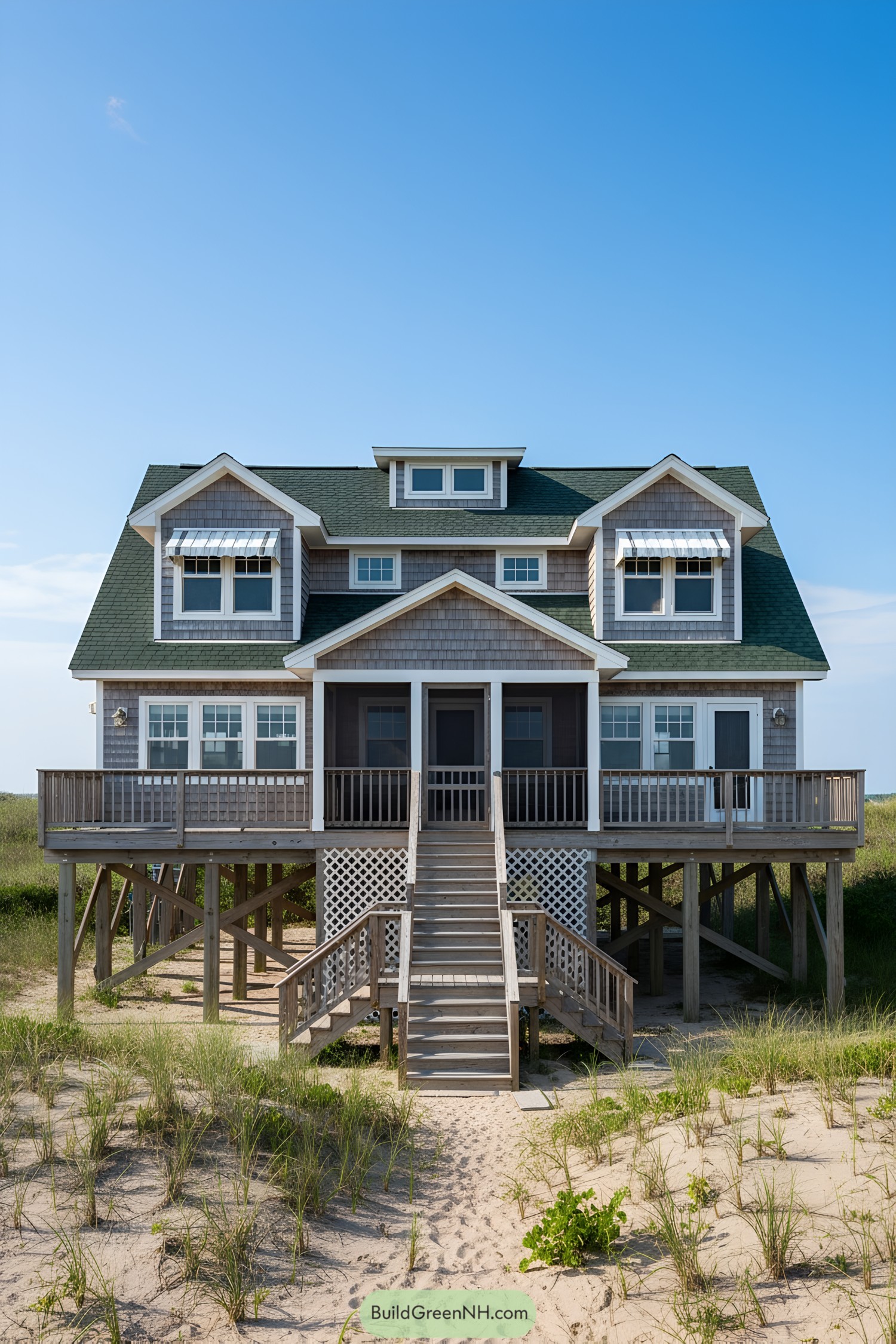 Charming stilt-raised beach cottage with a green roof