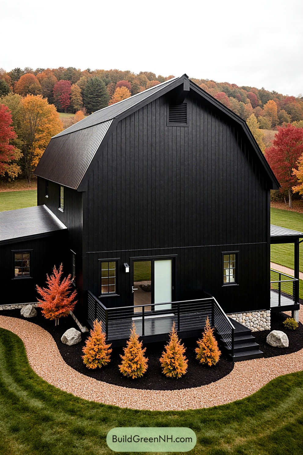 Black barndominium in a colorful autumn landscape