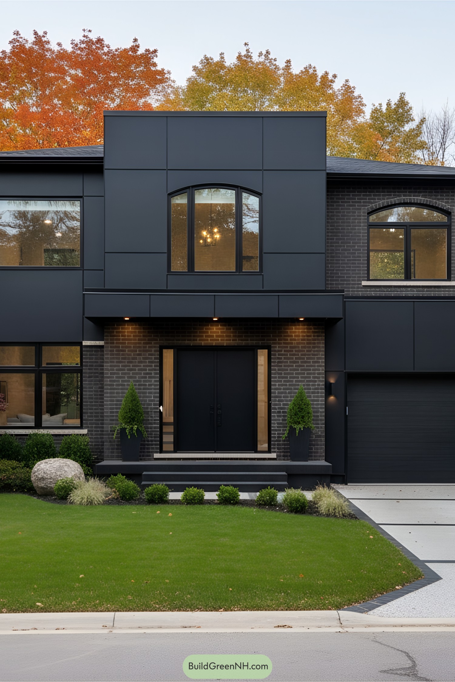 Stylish black house with lush green lawn