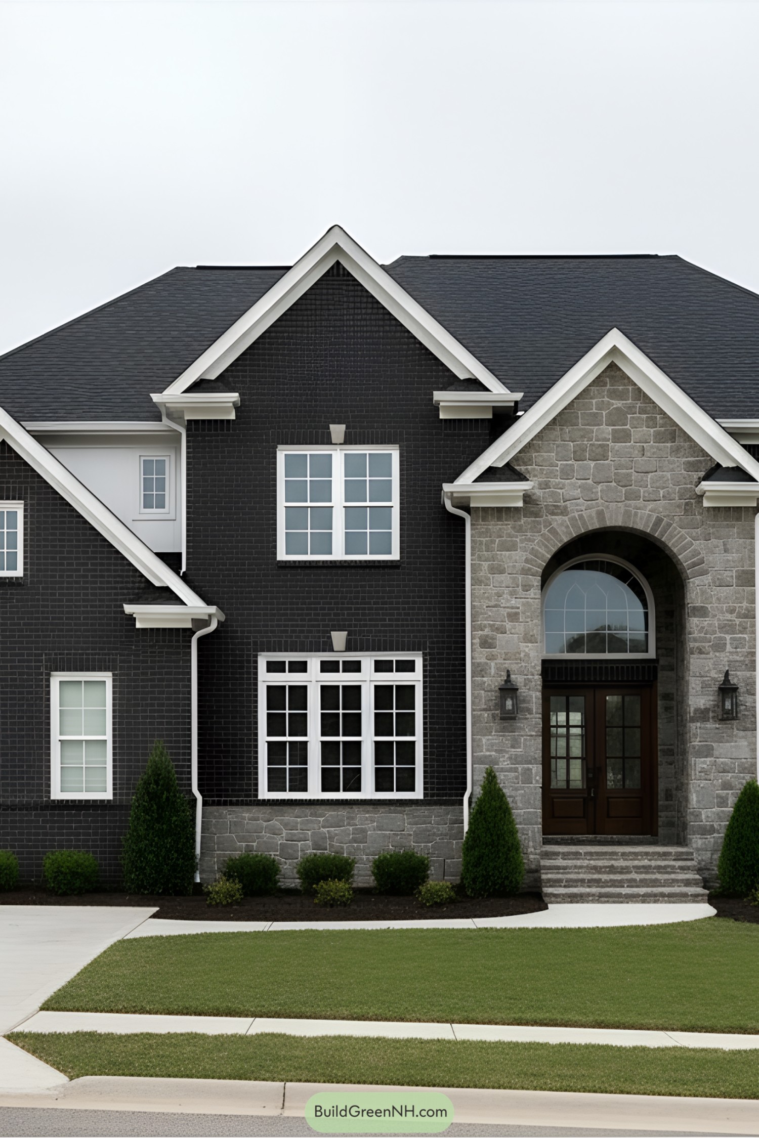 Black suburban house with stone accents and white trim