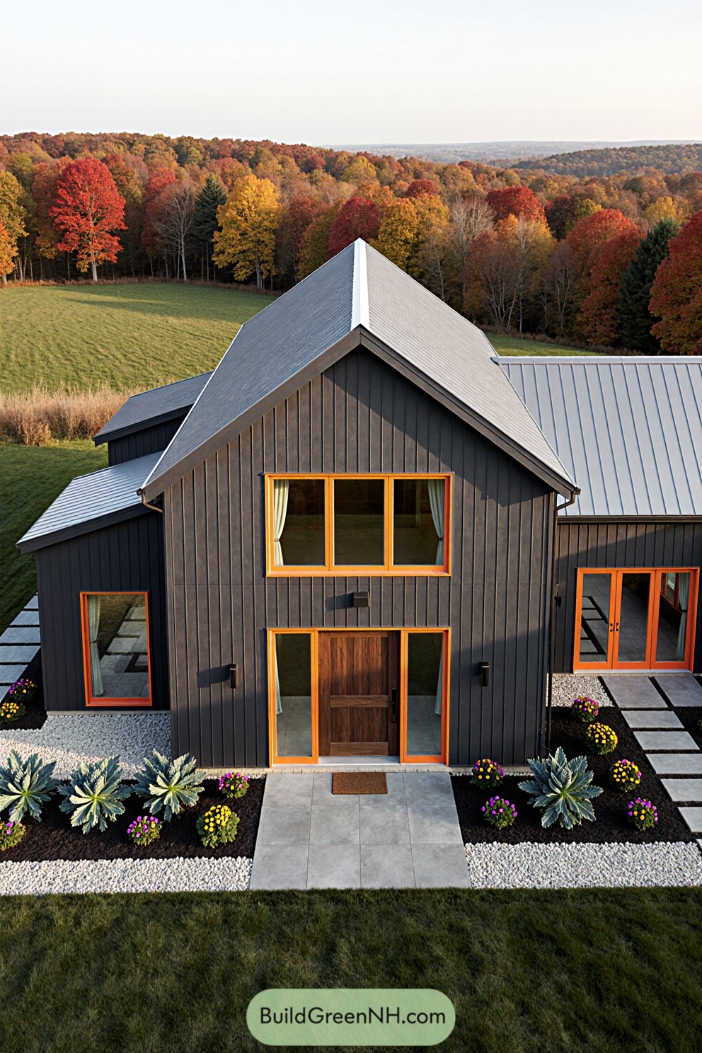 A contemporary farmhouse surrounded by vibrant fall trees