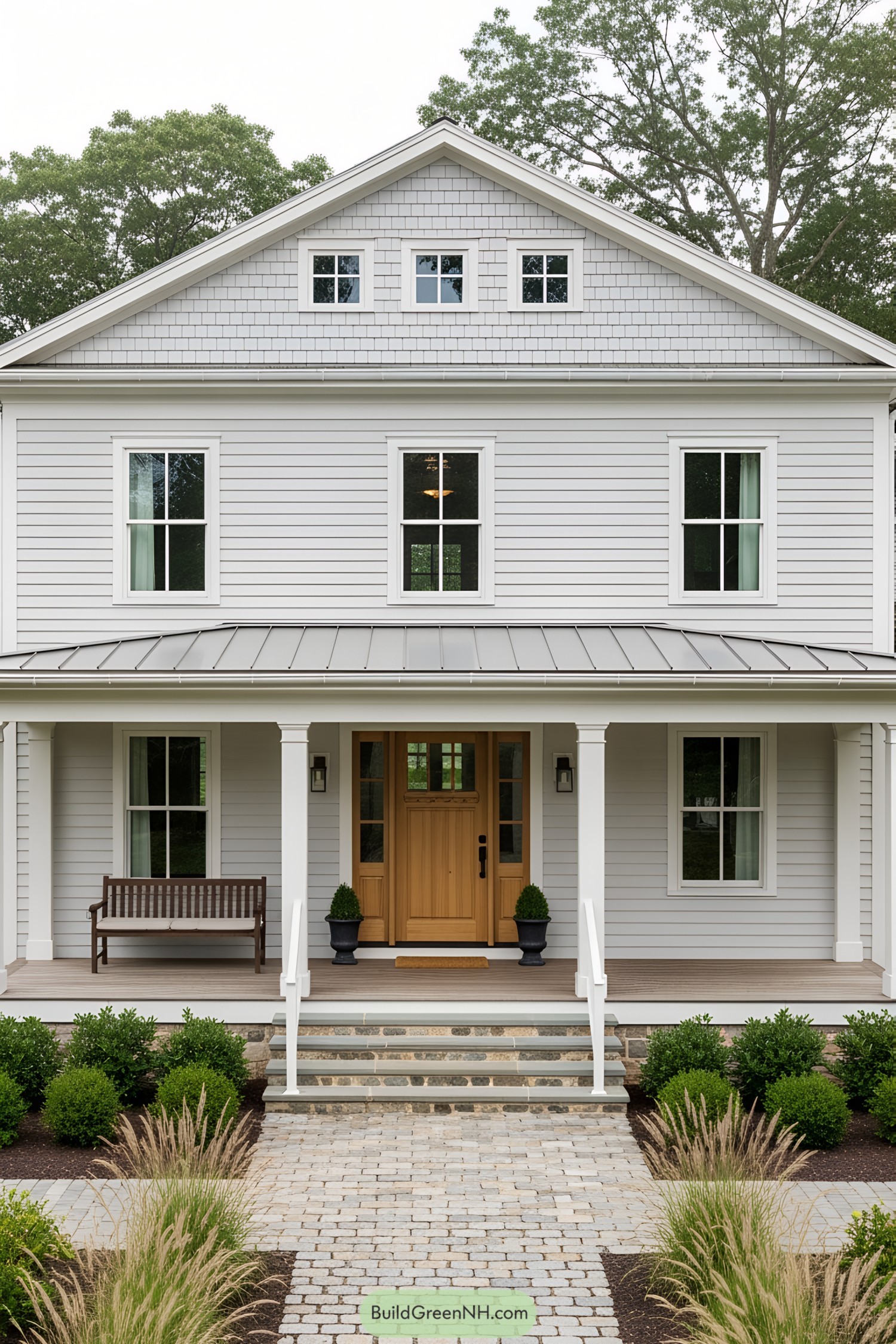 Farmhouse with gray siding and inviting wooden door