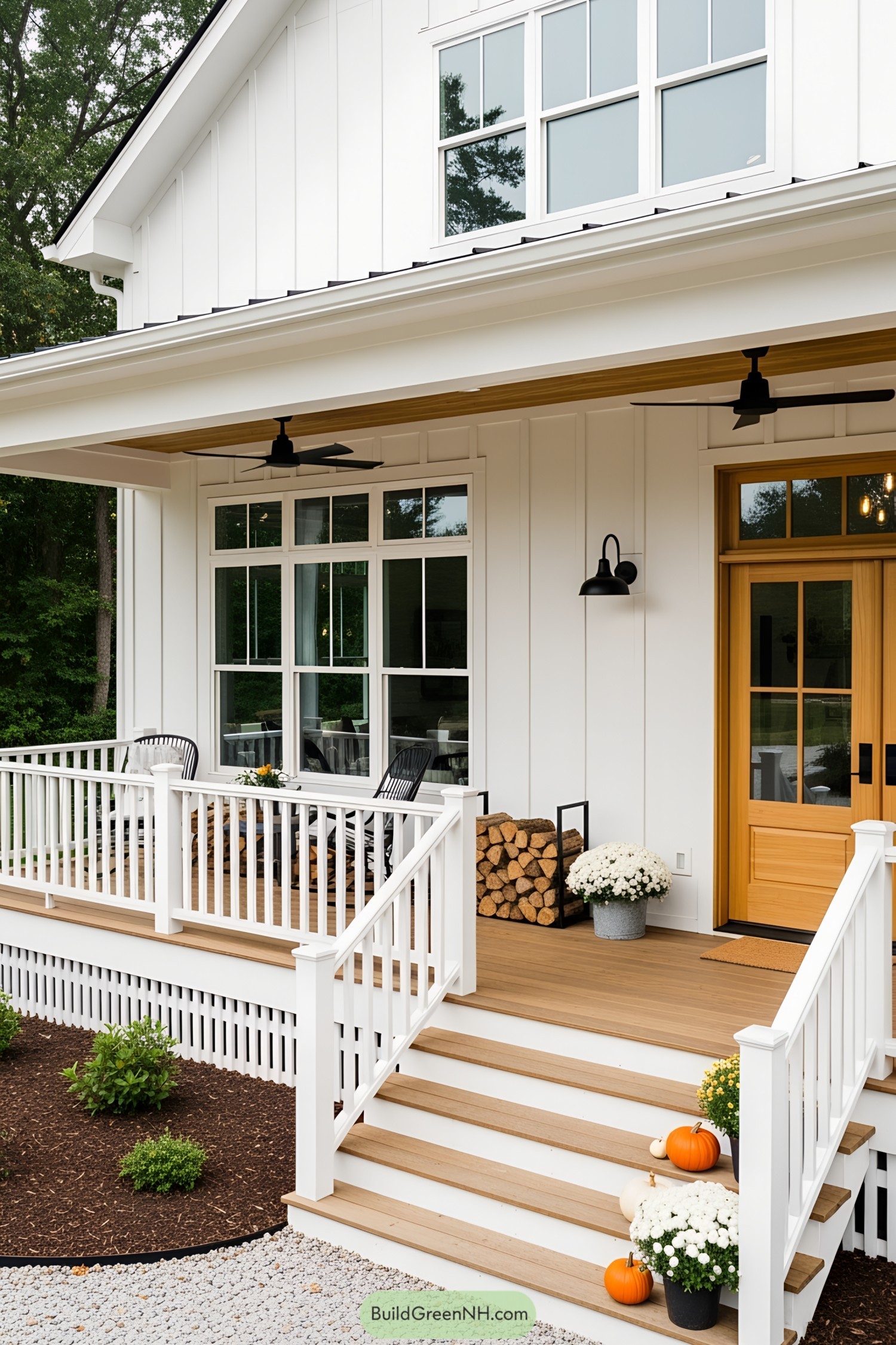 White farmhouse with cozy porch and autumn decorations