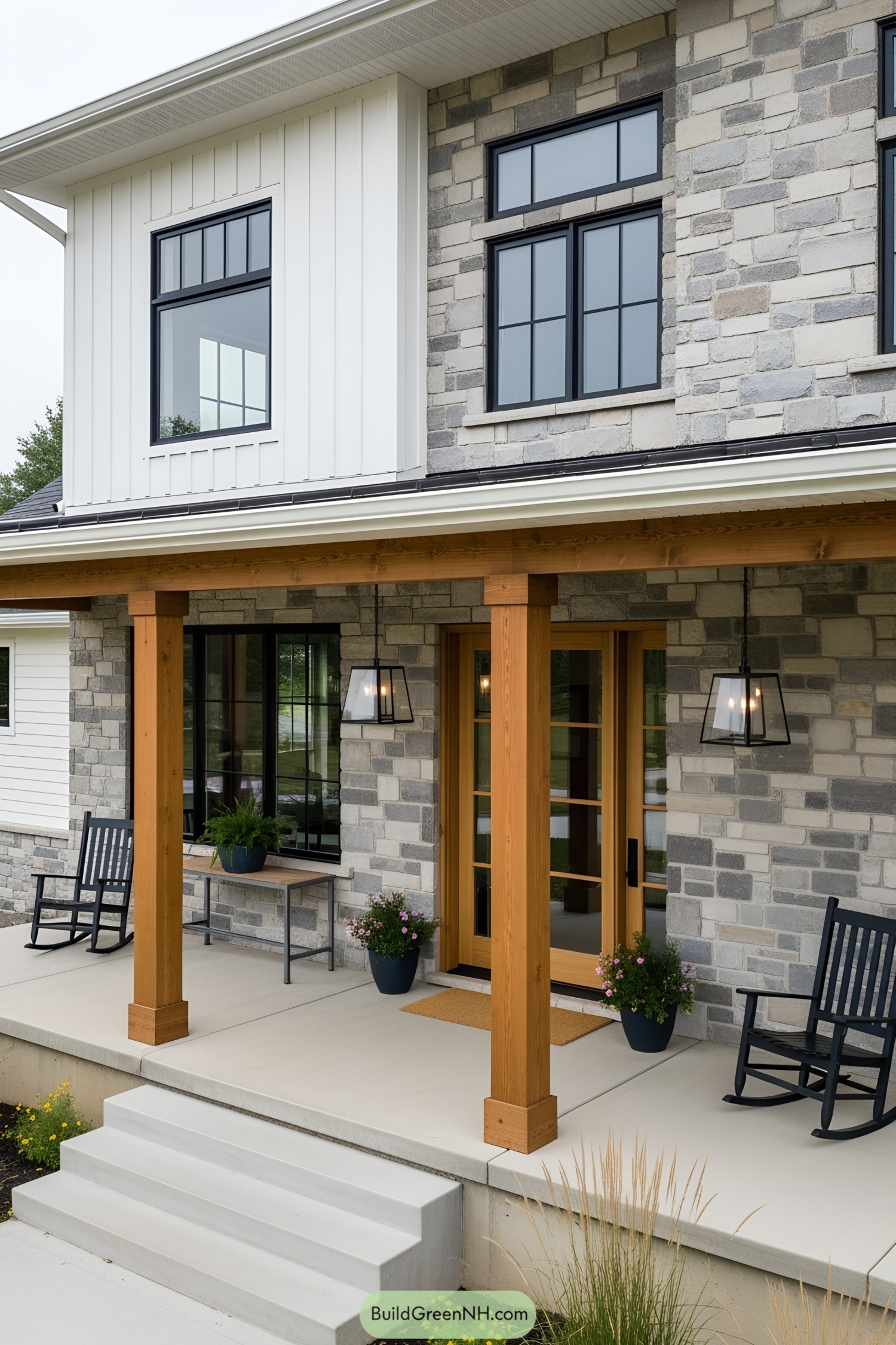 Farmhouse with a stone front porch and modern wooden pillars